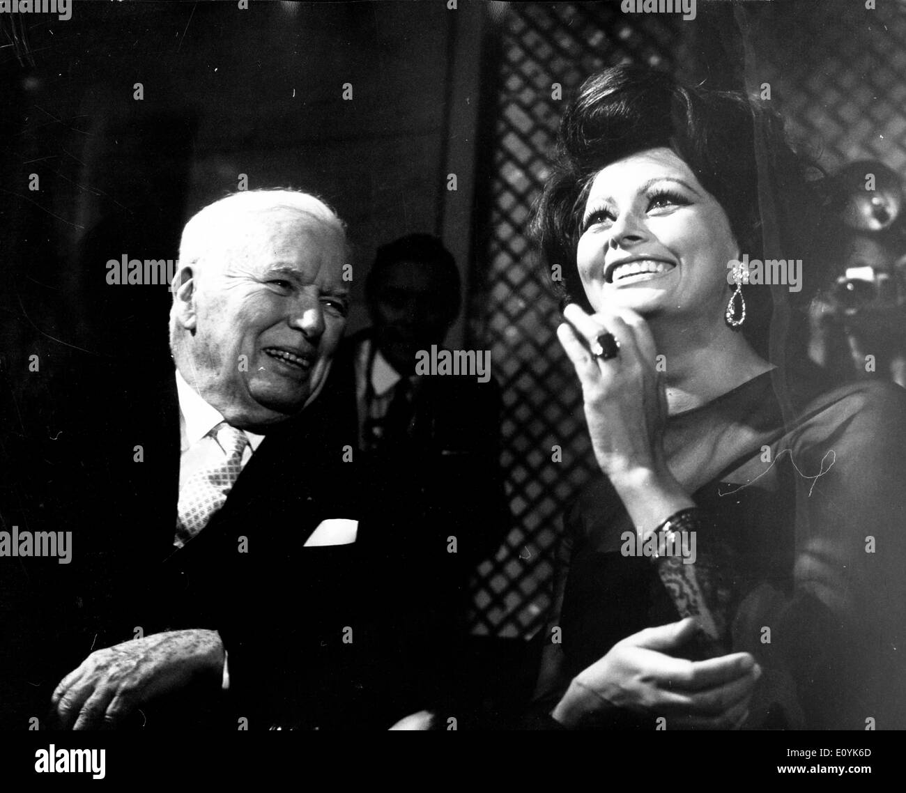 Actors Charlie Chaplin and Sophia Loren at party Stock Photo
