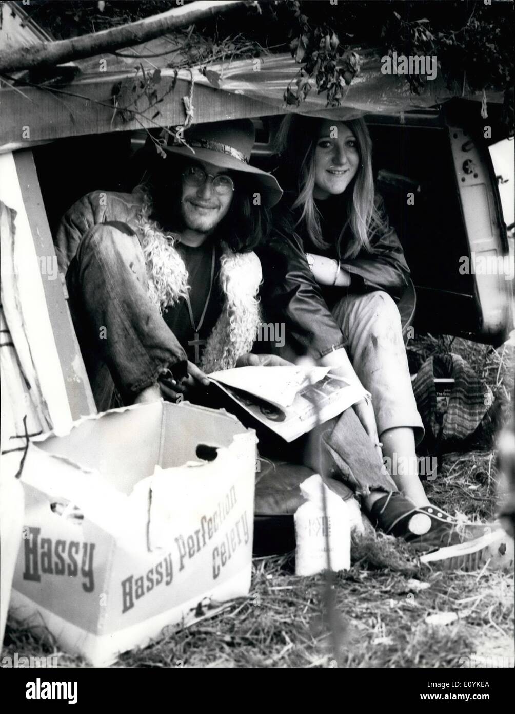 Aug. 08, 1970 - Pop Fans invade the Isle of Wight: Pop fans from all parts of the world are gathering at Freshwater, Isle of Wight, for the five day pop festival, which opened today. Photo shows two pop fans take things easy on the camping site at Freshwater, Isle of Wight. Stock Photo