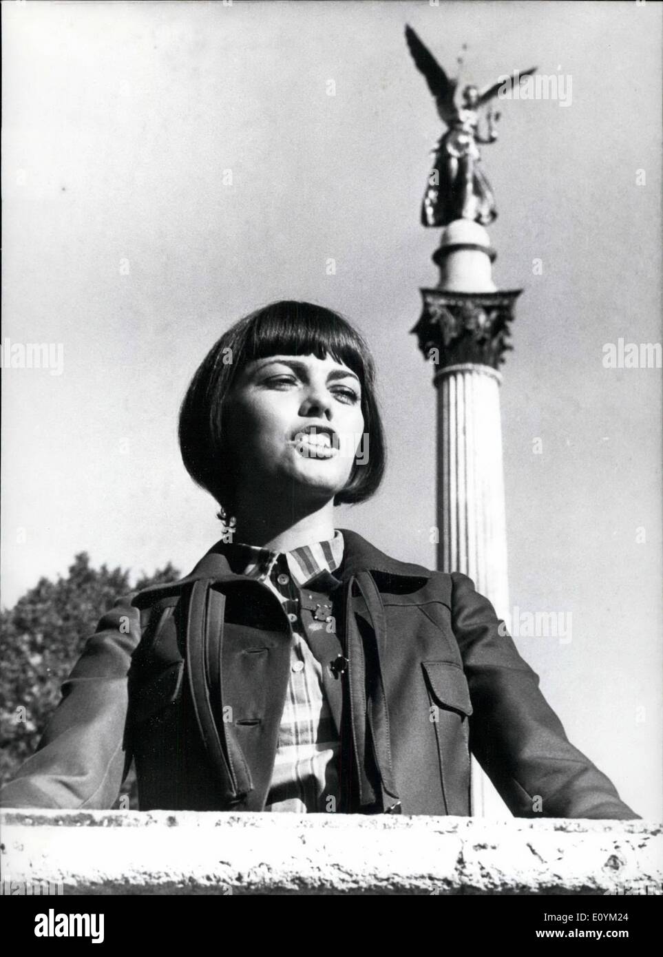 Sep. 09, 1970 - Dangling along the Isar-river in the latest Midi-fashion was French singer Mireille Mathieu when she visited Munich. Although she finds Munich wonderful, she stayed only for 24 hours to present her latest hit in German TV-Studios: ''Es geht mir gut, Cherie (I feel alright, Cherie)''. ''I feel alright, mercy, Cherie'' is the name of a show at Sept. 29th on German Television, channel two. Star of the show: Mireille Mathieu (our picture shows her in Front of the ''Angel of Peace'' in Munich) Stock Photo