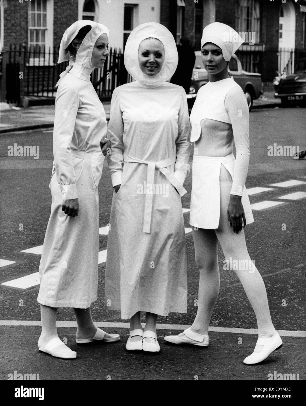 Oct 25, 1970 - London, England, United Kingdom - Models show revolutionary design for new uniforms designed for nurses by Pierre Cardin at the press preview of the London Nursing Exhibition. Cardin designed these uniforms with a new use of colors and design to maximize movement, freedom, and hygiene. Stock Photo