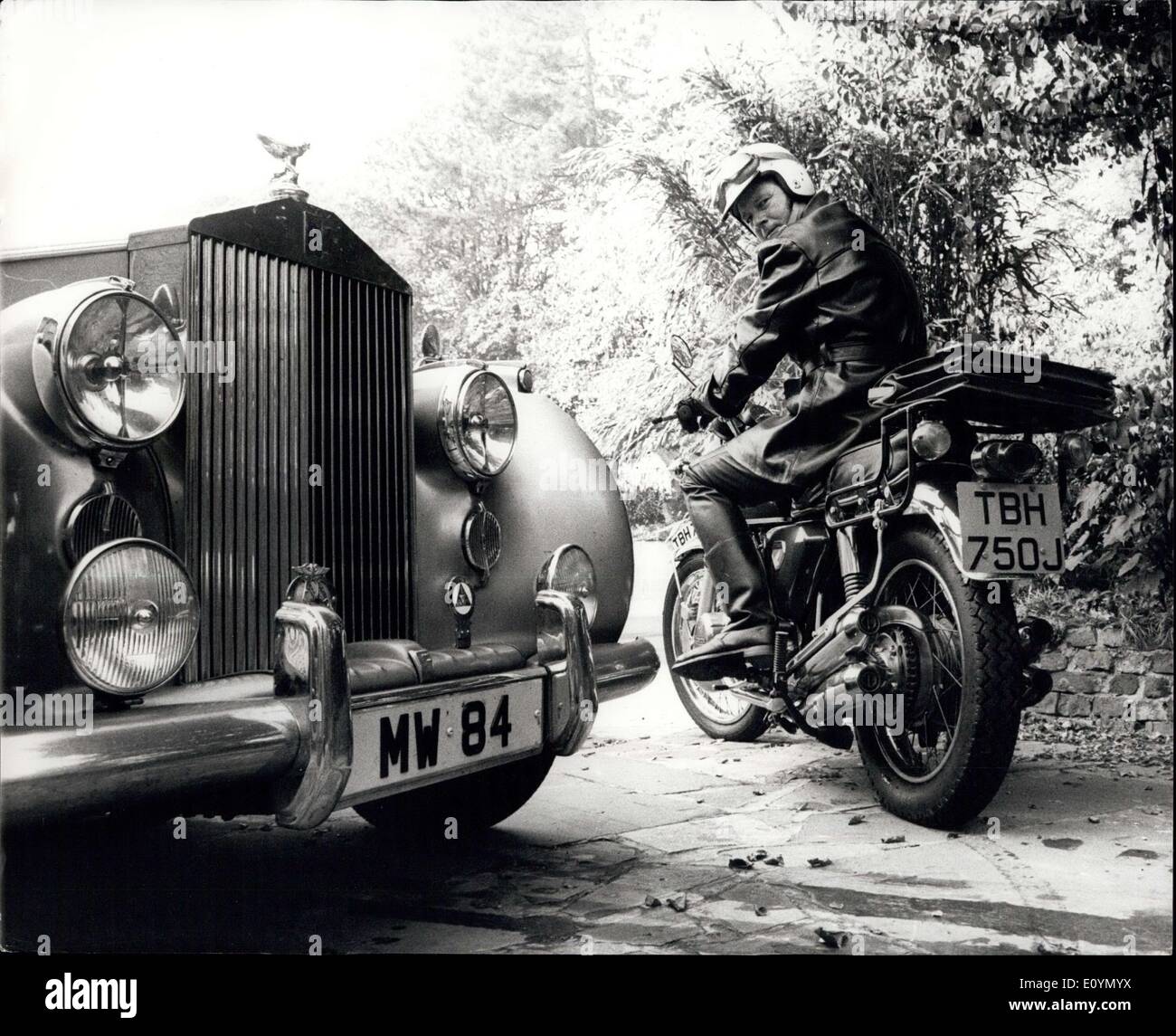 Oct. 31, 1970 - Managing director leaves his Rolls Royce in the Garage and sets off to his London office on a Motor Cycle : Each morning managing director Michael Wood leaves his Rools Royce in the garage - and sets off for his London office on his Japanese motor cycles. It used to take him an hour and a half along the M. 4 from his Maidenhead home to his Piccadilly, London, office. New it takes him just ever 50 minutes. His Rolls does cycles does 55. Said 42-year-old Mr. Wood, of Bath Road, Maidenhead. ''I get tired of travelling to London every day through heavy traffic Stock Photo
