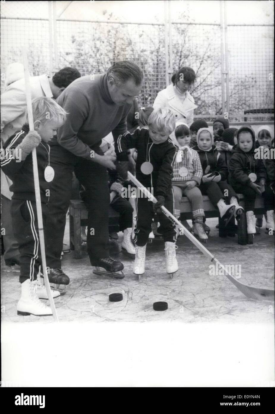 Nov. 11, 1970 - Nursery school with skating place in Dortmund. since a short time the boys and girls from the nursery school near the ''Westfallenhalls'' of Dortmund (Germany) can skate in the mornings due to the initiative of the known former ice hockey player Conecki. Two nurses have already been employed to look after the skating children. Of course the boys who are already a little successful are quite enthusiastic to be trained from time to time by a ''real ice hockey star'' like Conecki (photo). Meanwhile Inge and his little friend are real ice hockey players. Stock Photo