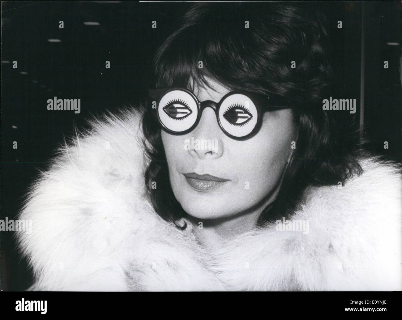 Dec. 12, 1970 - Juliette Greco in Munich for dubbing works. Juliette Greco who hides behind this funny disguise was only joking. The chansonette from Paris presented herself with these pop-clothing (photo) in Munich where she stayed for one day between a voyage to Japan and a tour through France in order to dub in the Bavaria-studios the two Heinz Liesendahl shows Paris After Notes and Corrida Musical in English. She got the funny glasses from a fan, and immediately tried it! Keystone Photo, December 2nd, 1970 Stock Photo