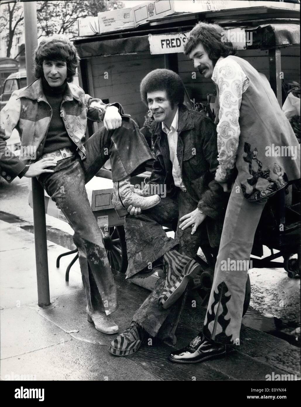 Jan. 01, 1971 - New World Pop Group. Try out the new topper shows. Group from Down Under : John Kane, John Lee and Mel Nochan the Popular Australian group were to be seen in King's Road, Chelsea today. trying out some of the new 1971 Ã¢â‚¬ËœTopper' shoe styles. There are many bold new designs including smart zebra skin cork and leather wedges and a new super shoe with Cuban heel which won a major design award in Italy. The shoes include a range of traditionally styled designs which would not disgrace the stock Exchange Stock Photo