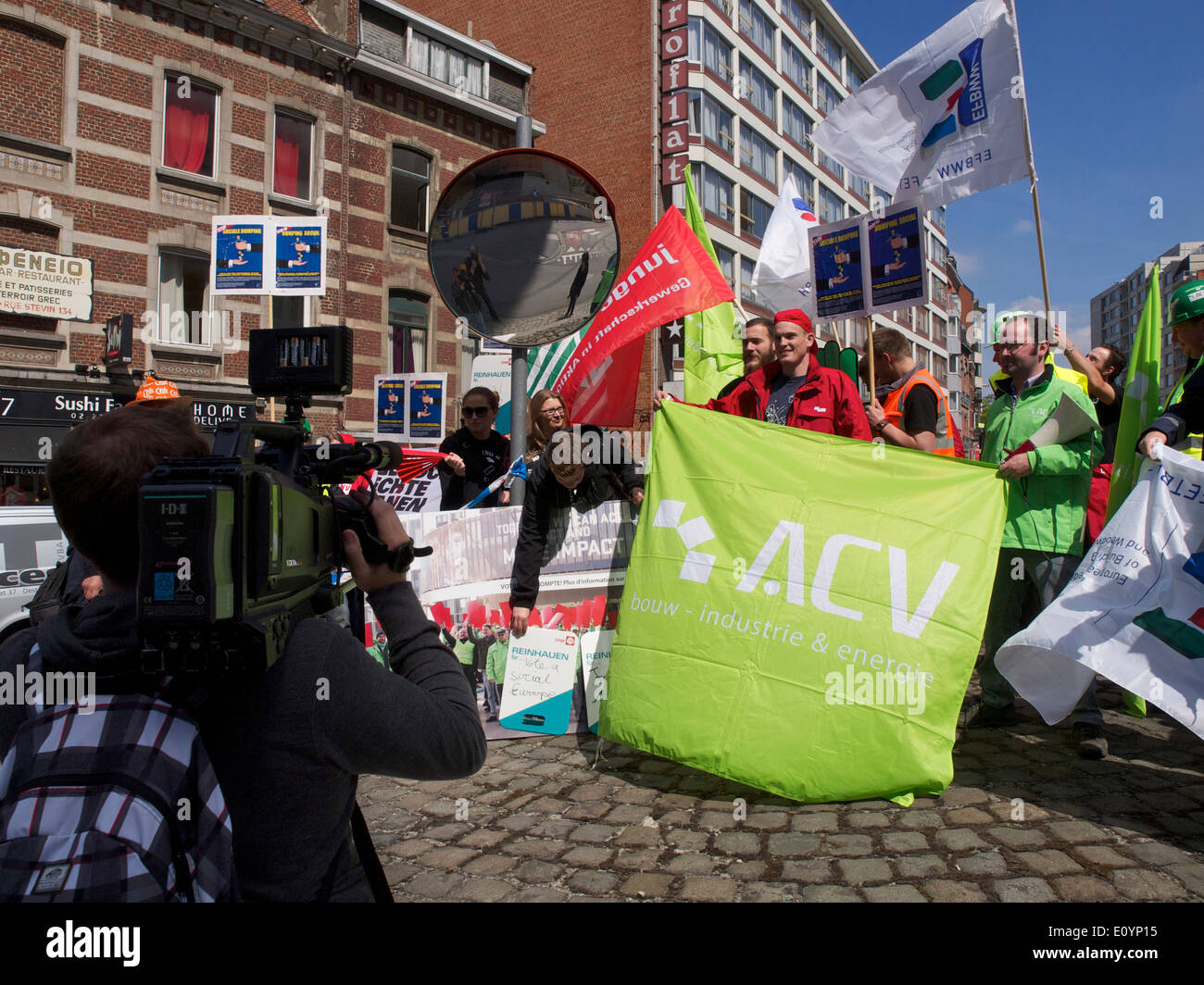 News cameraman filming protest at the European Commission in Brussels Belgium. Stock Photo