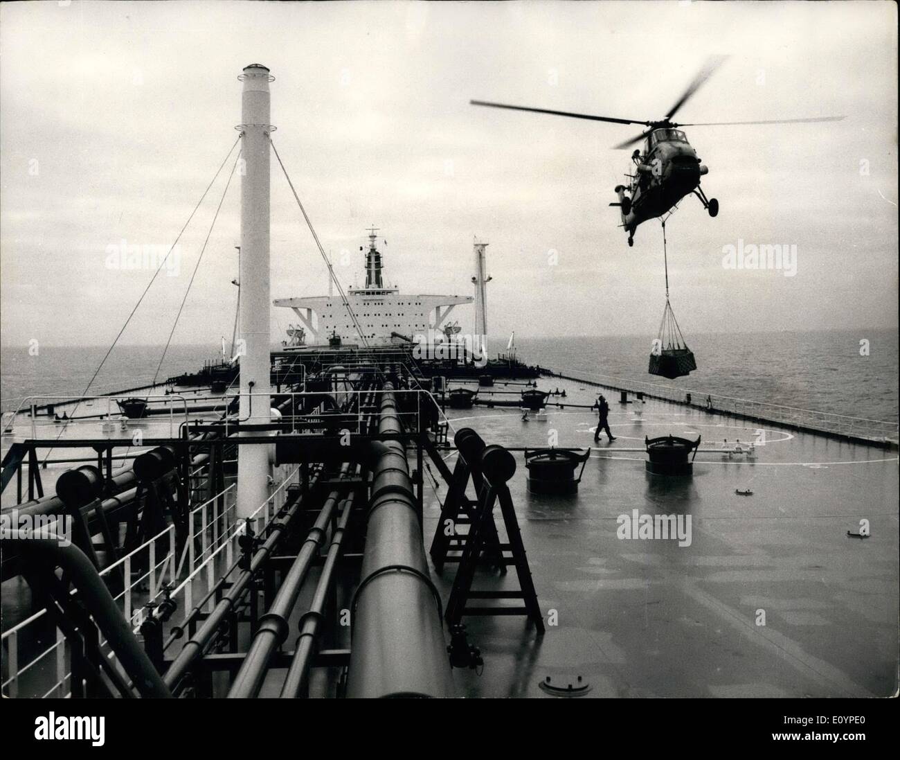 Feb. 02, 1971 - News service for tanker.: Radio and amchinery to print automatically a washeet for the new of BP's tanker, British 215,000 tons, were lowered aboard by in the English Channel ysterday. the tanker tomorrow on a tow-month voyage to the Persian Gu back. The Daily Telegraph is providing the news. Photo shows an R.A.F. Wessex helicopter lowering radio equipmkent on board the BP tanker British Explorer, in the English Channel yesterday. Stock Photo