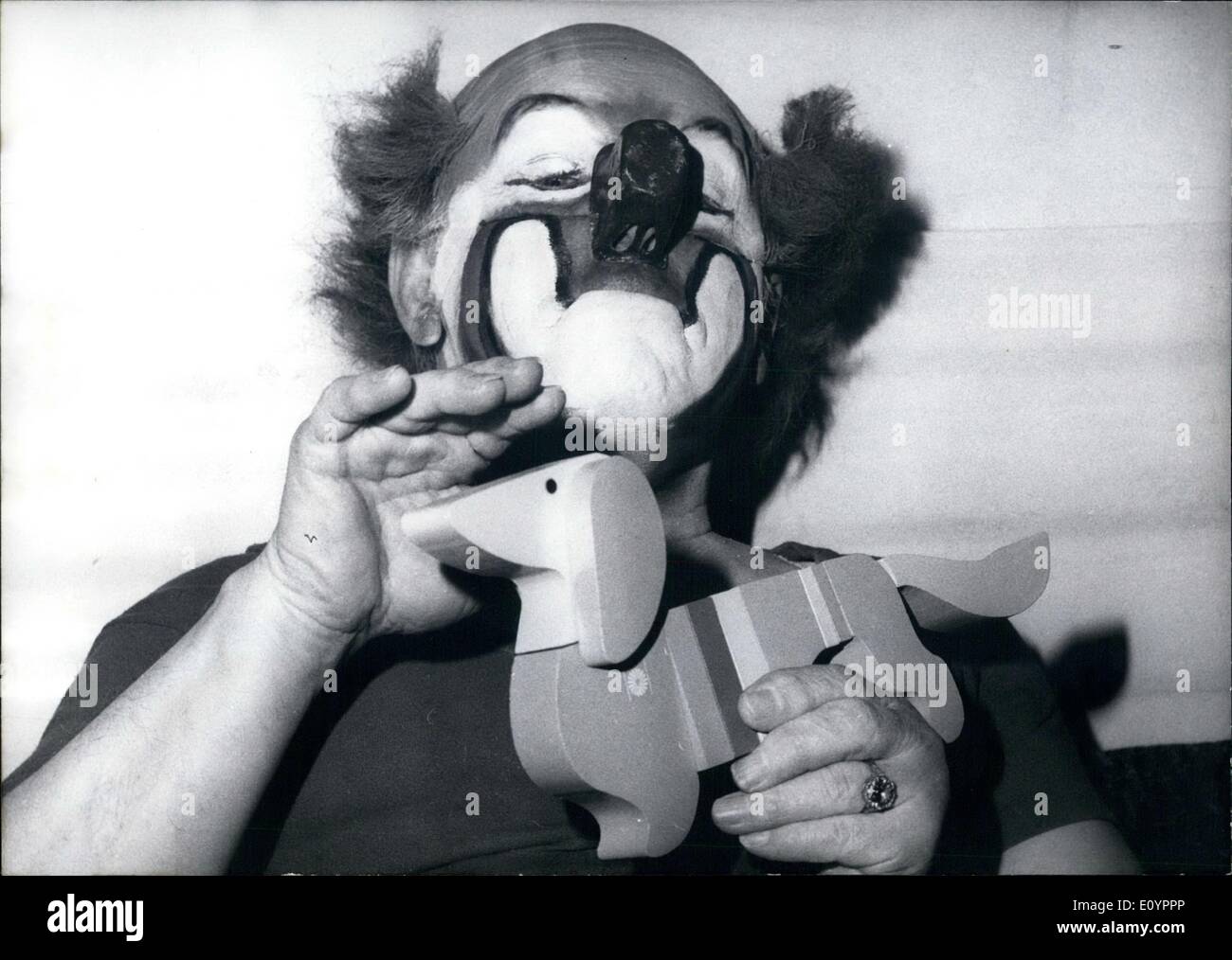 Mar. 03, 1971 - Charlie Rivel with Olympic badger-dog: Charlie Rivel, the famous clown was quite enchanted when he saw the Olympic badger-dog WALDI for the first time (photo). WALDI, who will be put on the market in a few weeks, will be available in wood, plastic and textile in different sizes and one hopes that WALDI will succeed in making some money for the Olympiad Stock Photo