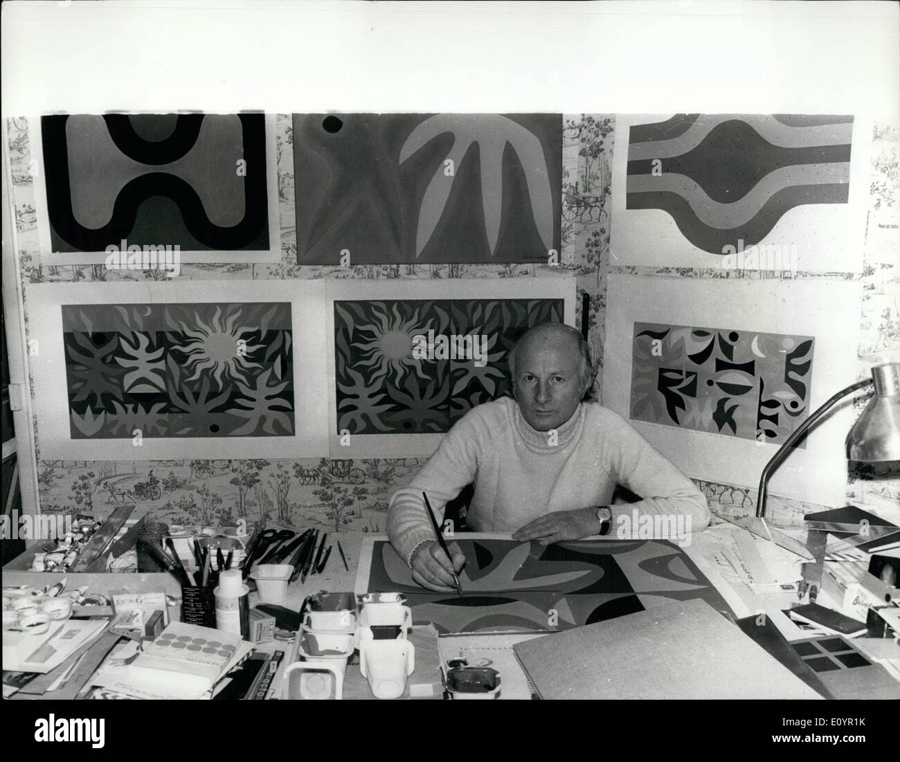 Mar. 03, 1971 - Curtains of sun and moon for Sydney Opera house.: John Coburn, Australian artist, is now at work in his Paris studio designing two tapestry curtains for the Sydney Opera house. One is ''The Curtain of the Sun'' - height 27 feet (830cm), width 52 feet (1600cm) - for the Opera theatre, in rich reds, yellows, pinks and browns; abstract shapes based on organic forms representing the elements of fire, earth, air and water dominated by a huge heraldic sun. The rays of the sun will have gold thread woven in with the yellow wool Stock Photo