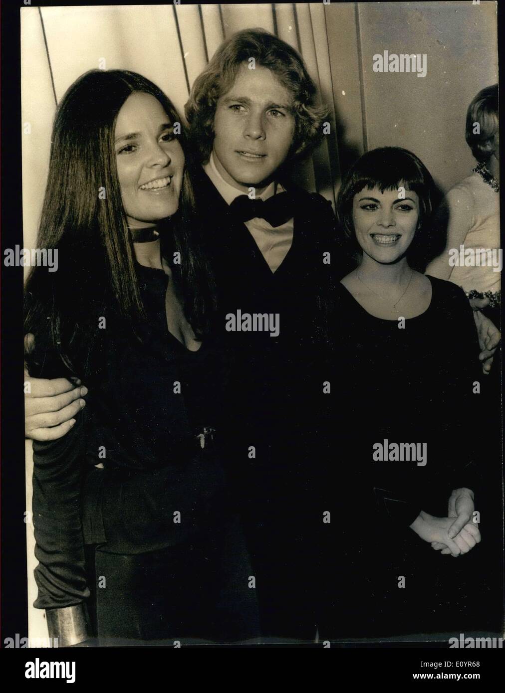 Mar. 20, 1971 - The stars of the movie, ''Love Story,'' Ryan O'Neal and Ali MacGraw are seen here with Mireille Mathieu at the movie's premiere Champs-Elysee Theater. Stock Photo