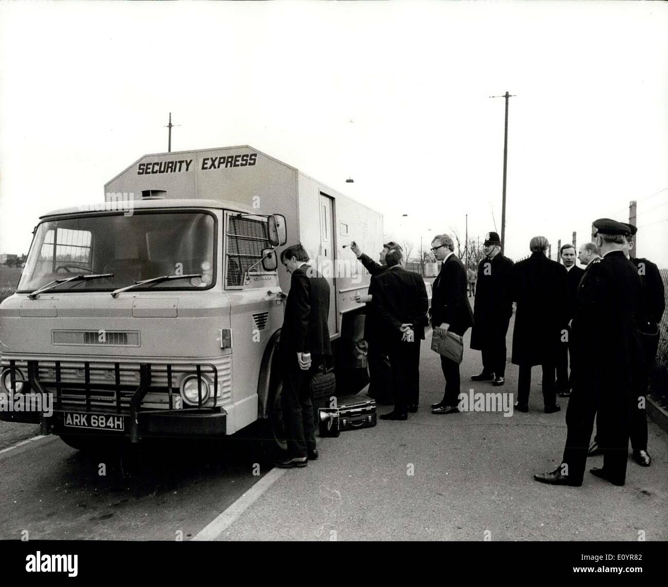 Mar. 27, 1971 - Shotgun Bandits grab ?458,000 in ambush when one of the security guards goes to public lavatory: four security guards who stopped their 8-ton armoured van in a lay-by in Purely Way, near Croydon, so that one of them could go into a public lavatory, were ambushed yesterday and robbed of ?458,000. Ten raiders, wearing stocking masks and carrying shotguns and cashes, forced the guards to open up the Security van, snatched 28 bags of banknotes and escaped in four vehicles, all of which were stolen.The robbery netted the largest cash haul since the Great Train Robbery in 1963 Stock Photo
