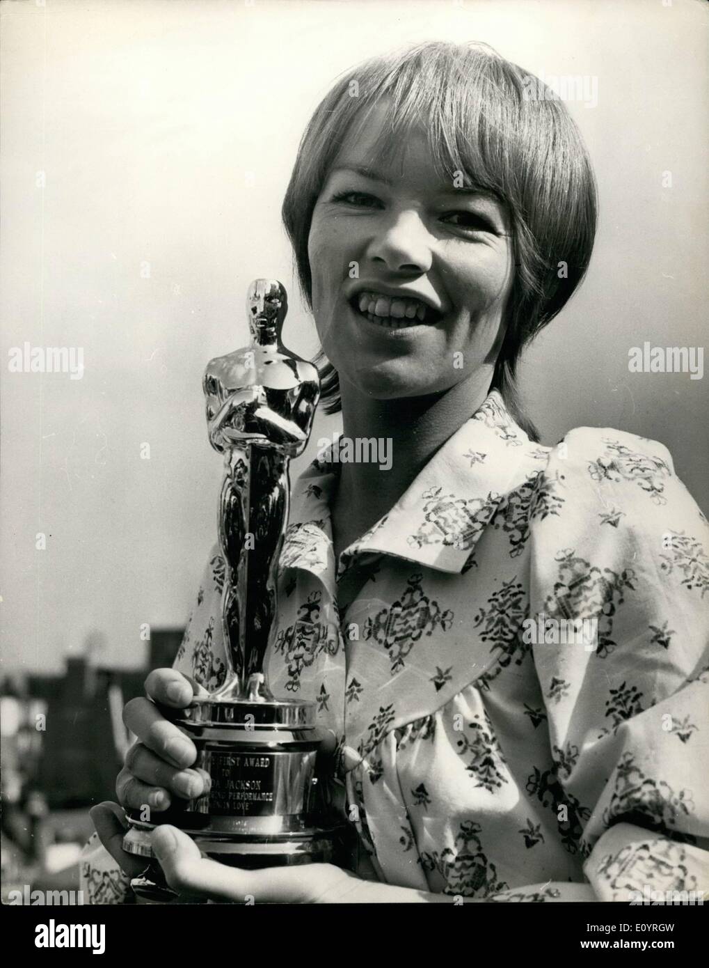 Apr. 04, 1971 - Hal B. Wallis, a member of the board of governors of the Motion Picture Academy of Arts and Sciences, today presented to Glenda Jackson on behalf of the Academy the Oscar she was awarded for her performance in ''Woman in Love''. Wallis, who arrived in London over the weekend to begin production on his film : Mary, Queen of Scots'', in which Miss Jackson co stars with Vanessa Redgrave, brought the Oscar with him from Hollywood. OPS: A happy Glenda Jackson pictured with her Oscar after the presentation at the Dochester Hotel today. Stock Photo