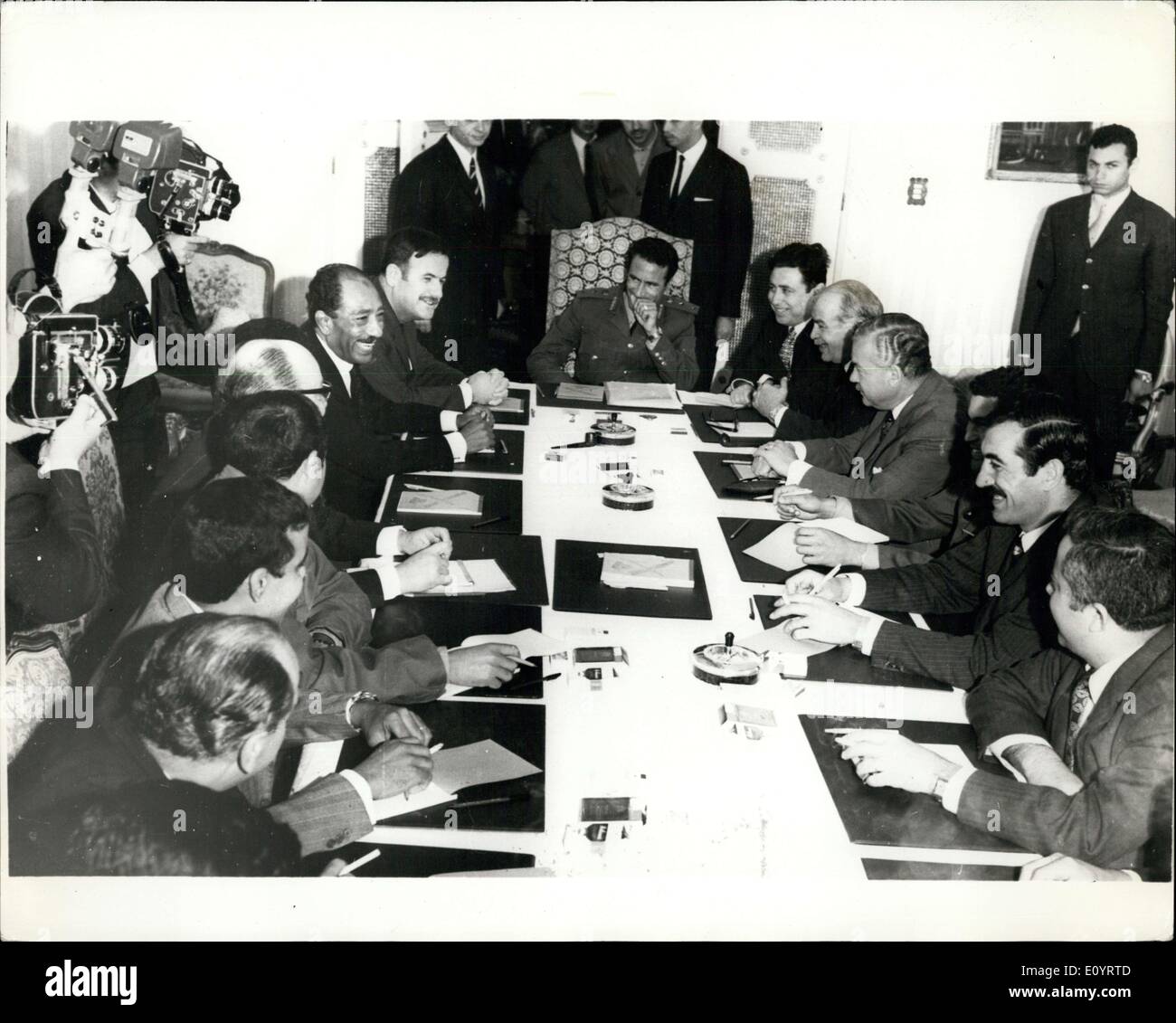 Apr. 23, 1971 - Tripoli heads hold talks in Benghazi. Decision to form Federation of Arab Republics.: At meeting held recently in Benghazi Egypt, Syria, and Libya took the decision to form the Federation of Arab Republic. Photo shows the three Presidents during their meeting at the Guest Palace in Benghazi. Presideng the meeting is Libyan President Moamer El Geddafy flanked on the left by Syrian and UAR Presidents Gen. HAfez El Acsad and Anwar El Sadat, and on right by UAR Vice-Presidents Aly Sabry and Hussein El Chaffei. Stock Photo