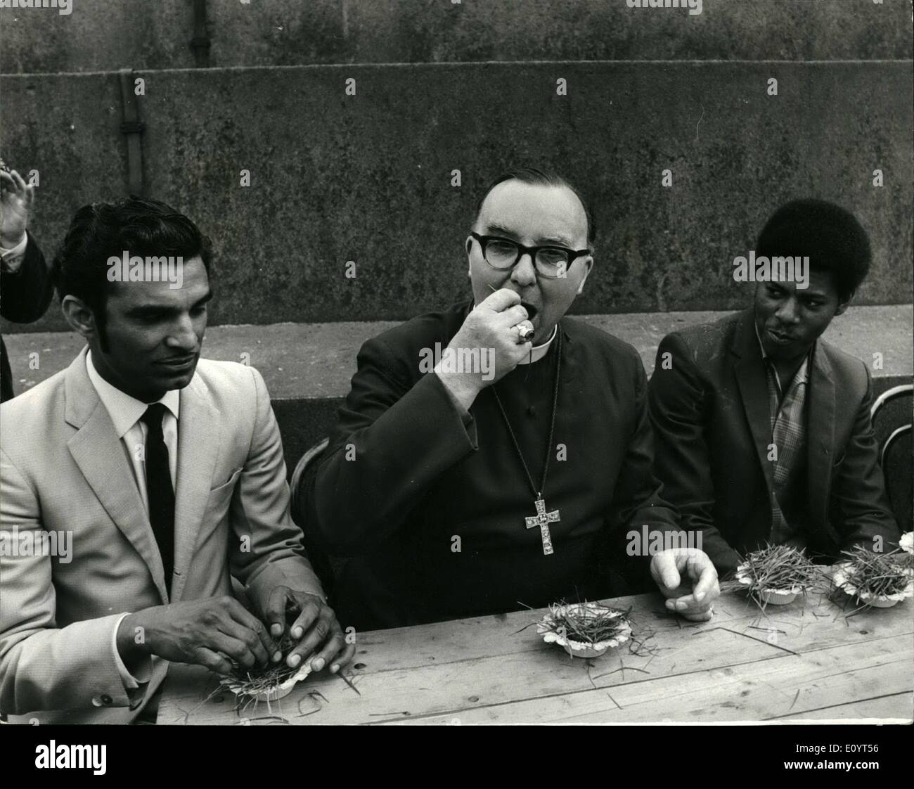 May 05, 1971 - Church Leader Invited To Eat Grass During Christian Aid Demonstration In Trafalgar Square: Church leaders were asked by young Africans and Asians to sit with them in Trafalgar Square today and share a meal of grass during a Christian Aid Demonstration. Grass, they say, is sometimes the only 'food' available to some of the World's poor - and taken on an empty stomach it can be killer Stock Photo
