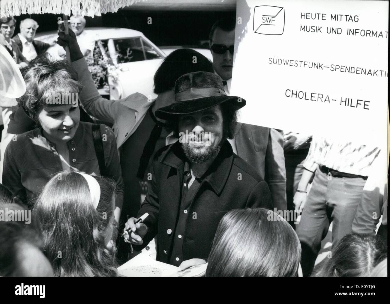 Jun. 06, 1971 - Autographs for the benefit of the Cholera Victims of the Pakistani war sold the French Singer Daniel Gerard at the Baden-Baden ''Flea market''. Surrounded by hundreds of fans he sold thousands of singles with his new song ''Butterfly'' after singing them. His German record company spent the singles for the auction. Stock Photo