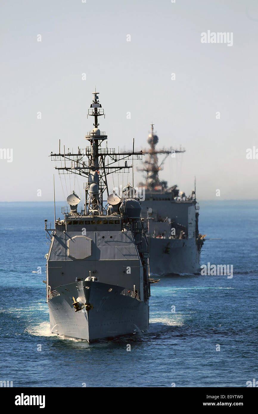 The US Navy USS Lake Champlain leads the USS Comstock in a battle formation during a strait transit exercise conducted during Composite Training Unit Exercise May 14, 2014 off the coast of San Diego, California. Stock Photo
