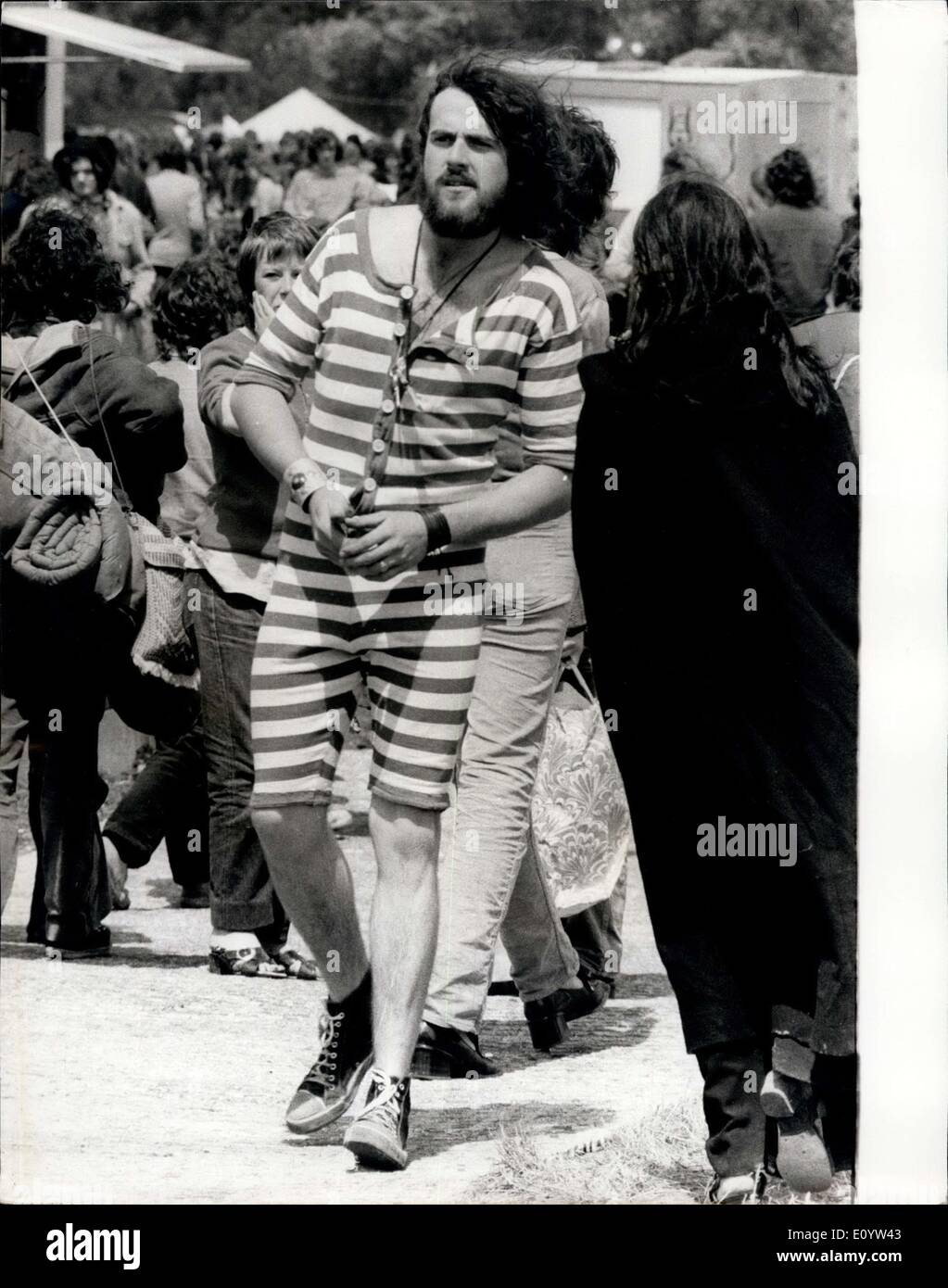 Jun. 27, 1971 - Hieppie' Police seize 100 pop fans at a Pop Festival in reading: Detectives in hippie gear searched hundred of teenagers for drugs at the Reading Pop Festival yesterday, and more than 100 fans were arrested. It was estimated that some 20,000 fans attended, many of them comped out all night despite the heavy rain. Photo Shows One of the pop fans dressed in an old fashioned bathing suit at the Pop Festival yesterday. Stock Photo