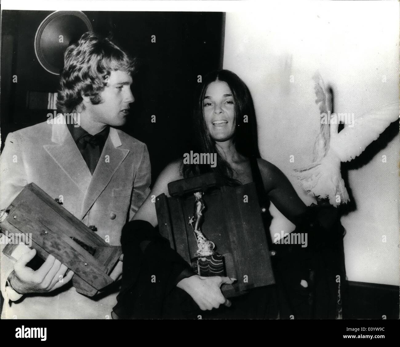 Jul. 07, 1971 - David of Donatello Film Awards: Ali Macgraw and Ryan O'Neill, stars of the film ''Love Story'' - pictured with their trophies after the David of Donatello Film Awards presentation ceremony in Rome. The event, to raise funds for the restoration of art treasures in the ''Sucola Grande Di San Marco in Venice was planned to put Italy in stop with other nations that have generously arranged benefits to aid the dying lagoon city. Stock Photo