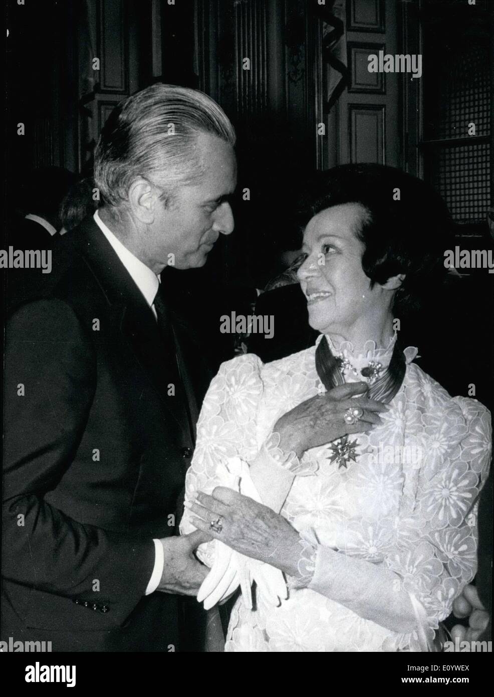 Jul. 20, 1971 - Opera singer Lily Pons received the National Order of Merit Cross yesterday during a reception held at the Matignon Hotel. Jacques Chaban-Delmas presented the award. He is seen here congratulating her after the presentation. Stock Photo