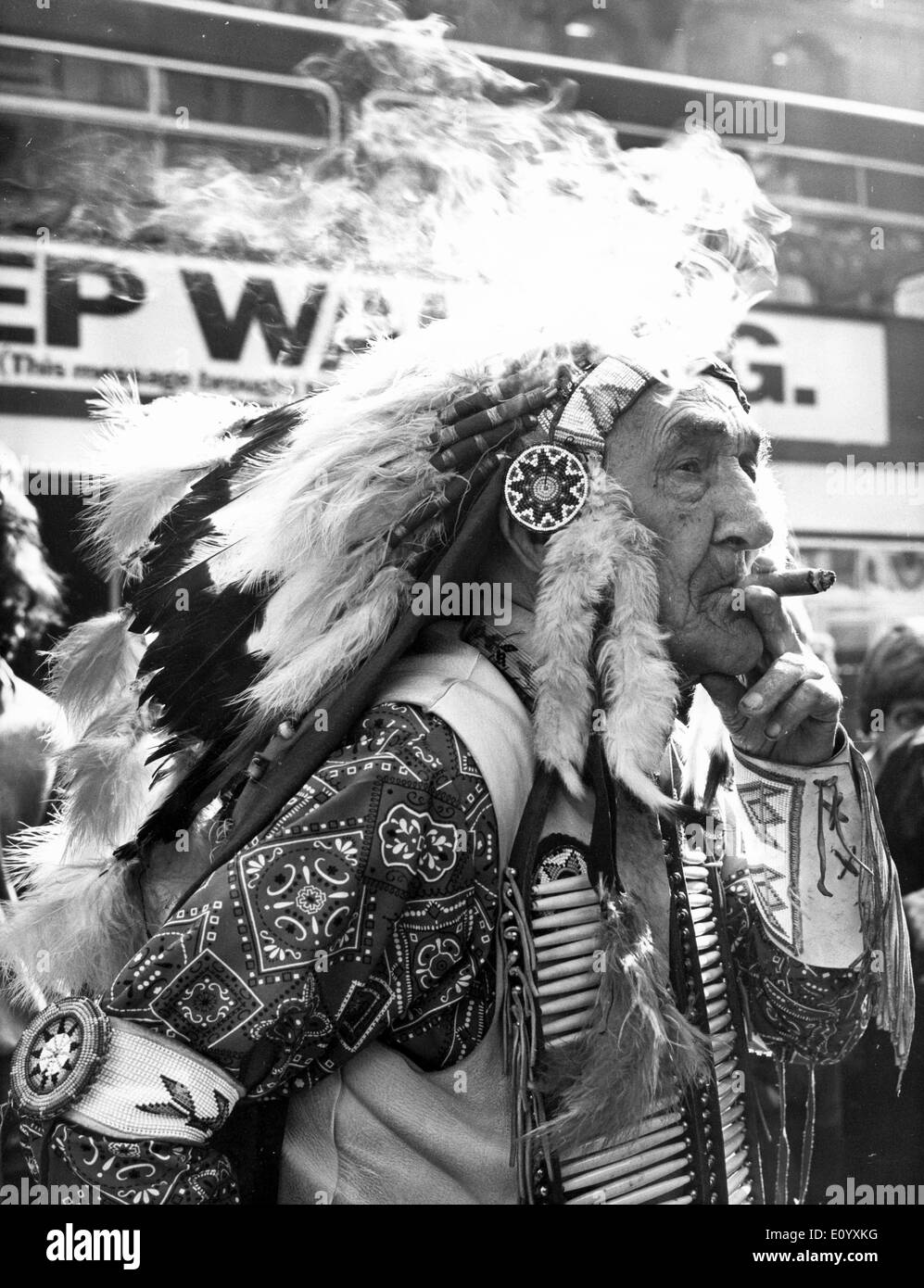 Oct 08, 1971; London, UK; CHIEF RED FOX, 101 year old Sioux chief, is in London to publicise his autobiography 'Memoirs of Chief Red Fox.' He is the nephew of the famous Chief Crazy Horse. The picture shows Chief Red Fox smoking one of his cigars in London. He smokes 18 a day and says they give him vitality. Stock Photo
