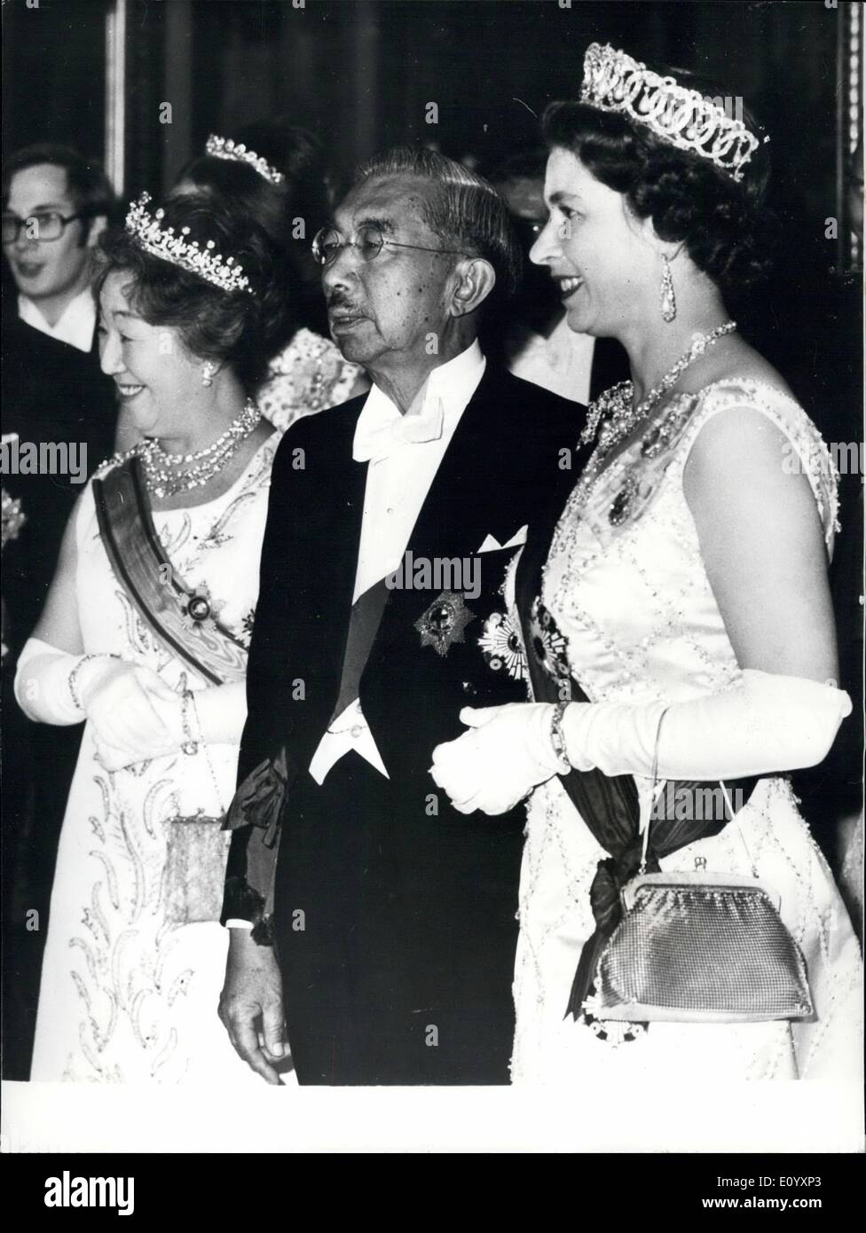 Oct. 10, 1971 - The Emperor Wears His Order Of The Garter: To mark the end of the first day Emperor Hirohito's State visit to London a Banquet was held in Buckingham Palace in Honour of the Japanese guests. Photo shows H.M. The Queen chats to Emperor Hirohito of Japan who is seen wearing for the first time since its restoration to him the Order of the Garter. On the left if Empress Nagako, in the Music room of the Palace, last night. Stock Photo