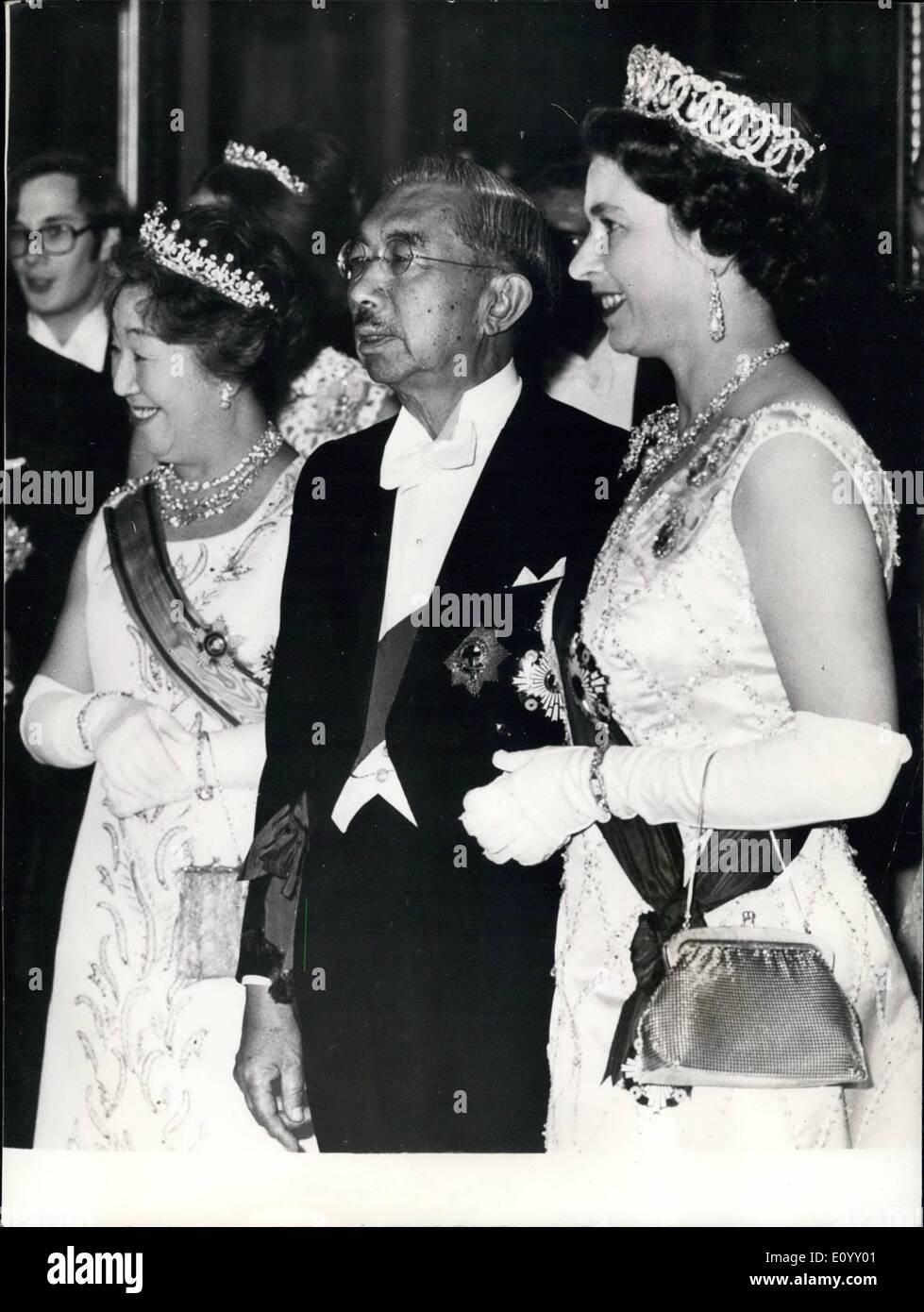 Oct. 10, 1971 - The Emperor wears his order of the Garter; To mark the end of the first day of Emperor Hirohito's state visit to London a Banquet was held in Buckingham Palace in honour of the Japanese guests. Photo Shows H.M. The Queen chats to Emperor Hirohito of Japan who is seen wearing for the first time since its restoration to him the order of the Garter. On the left if Empress Nagako in the Music room of the Palace, last night. Stock Photo