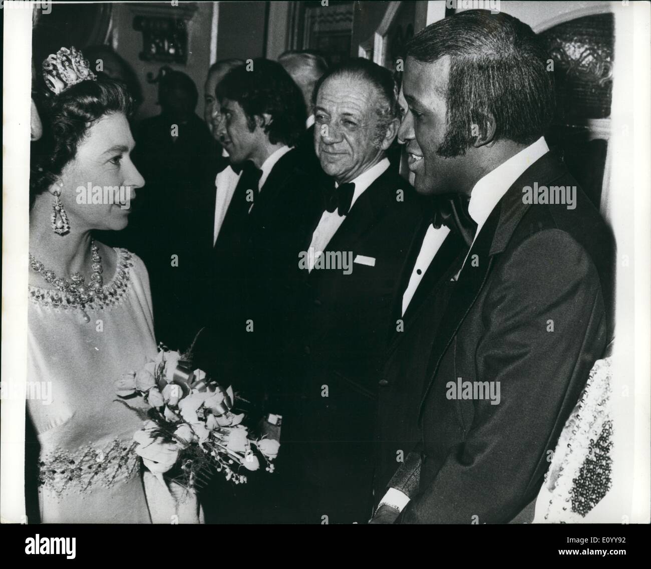 Nov. 11, 1971 - H.M. Queen at Royal Variety performance: Following last night's Royal Variety performance at the London Palladium. H.M. The Queen meets American singing star, Lovelace Watkins (right), who took park in the show. Next to Lovelace is comedian, Sidney James, Watkines, who flew from Melbourne, Australia for the one right performance, is due to return to Australia to continue his engagements there. Stock Photo