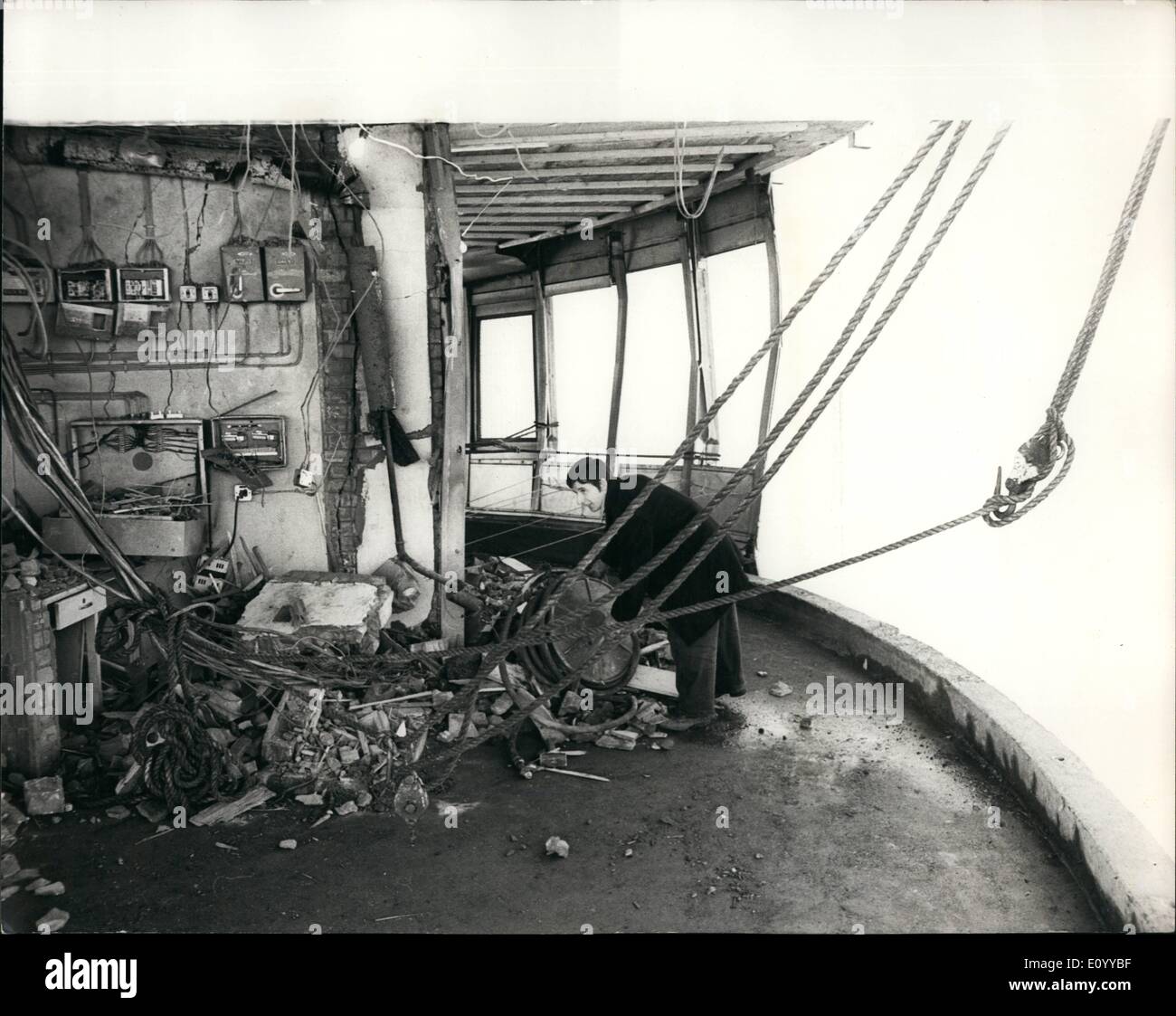Nov. 11, 1971 - The aftermatch of the post office tower explosion: Today the debris was being cleared away and clearing up operations were being carried out following yesterday's bomb blast which damaged three floors of the 620-feet high Post Office Tower. Photo Shows A workman is seen clearing away the debris caused by the bomb blast on the 31st floor of the Post Office Tower yesterday. Stock Photo