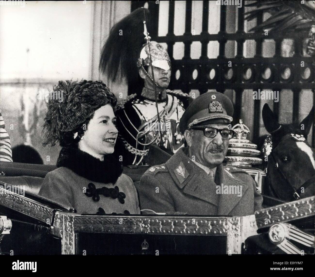Dec. 07, 1971 - King Of Afghanistan om State Visit.: King Muhammad Zahir Shah, of Afghanistan arrived in London today, accompanied by his daughter, Princess Bilquis, on a State Visit. Queen Homaira has been prevented by illness from travelling with her husband. H.M. Queen Elizabeth was at Victoria Station to greet the Royal visitors. Photo shows H.M. The Queen and King Muhammad Zahir Shah drive through the forecourt of Buckingham Palace in the open state carriage,after the procession from Victoria Station. Stock Photo