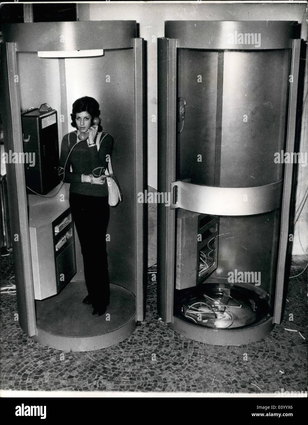 Dec. 12, 1971 - New Type Of Telephone Kiosks For Munich Olympic Site: Especially designed - the Federal Post Office are installing this new type of telephone kiosk for visitors to next year's Olympic Games in Munich. They are just over 6ft tall, and are constructed of steel and aluminum. The floor is covered by a fireproof fabric, and console for two directories can also be used as a desk and the round sliding door is made of safety glass. Stock Photo