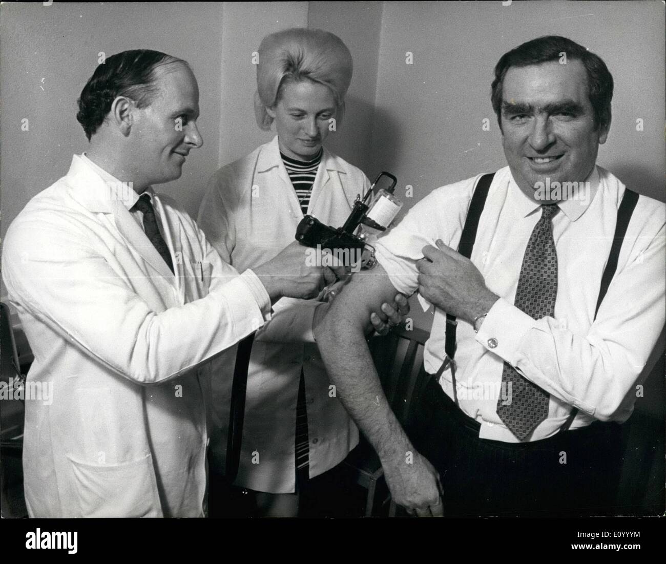 Dec. 12, 1971 - Mr. Healey takes advantage of free inoculation facilities at the commons. Mr. Healey an expert in matters of defence. taking advantage of free inoculation facilities at the commons yesterday when MP's of all parties decided to join him and build up a strong resistance to influenza. Stock Photo