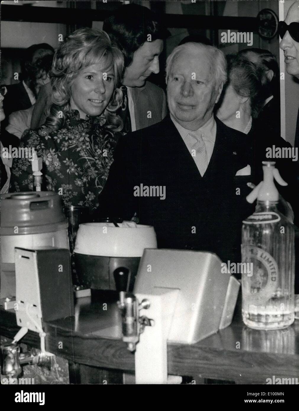 Feb. 02, 1972 - Charlie Chaplin visits ''Charlie Chaplain'': Charlie Chaplin, the famous film comedian today paid a visit to the ''Charlie Chaplin'' PUB at the Elephant and Castle, London, S.E. where he attended a special reception to mark the Royal Gala Charity Premiere of the comedian's film ''Modern Times'', which will be attended by Princess Alexandra abd her husband at the Paramount Theatre, Lower Regent Street, this evening. Photo shows Charlie Chaplin chats with Margaret Sartain, wife of the license of the 'Charlie Chaplin' pub - at the bar of the pub today. Stock Photo