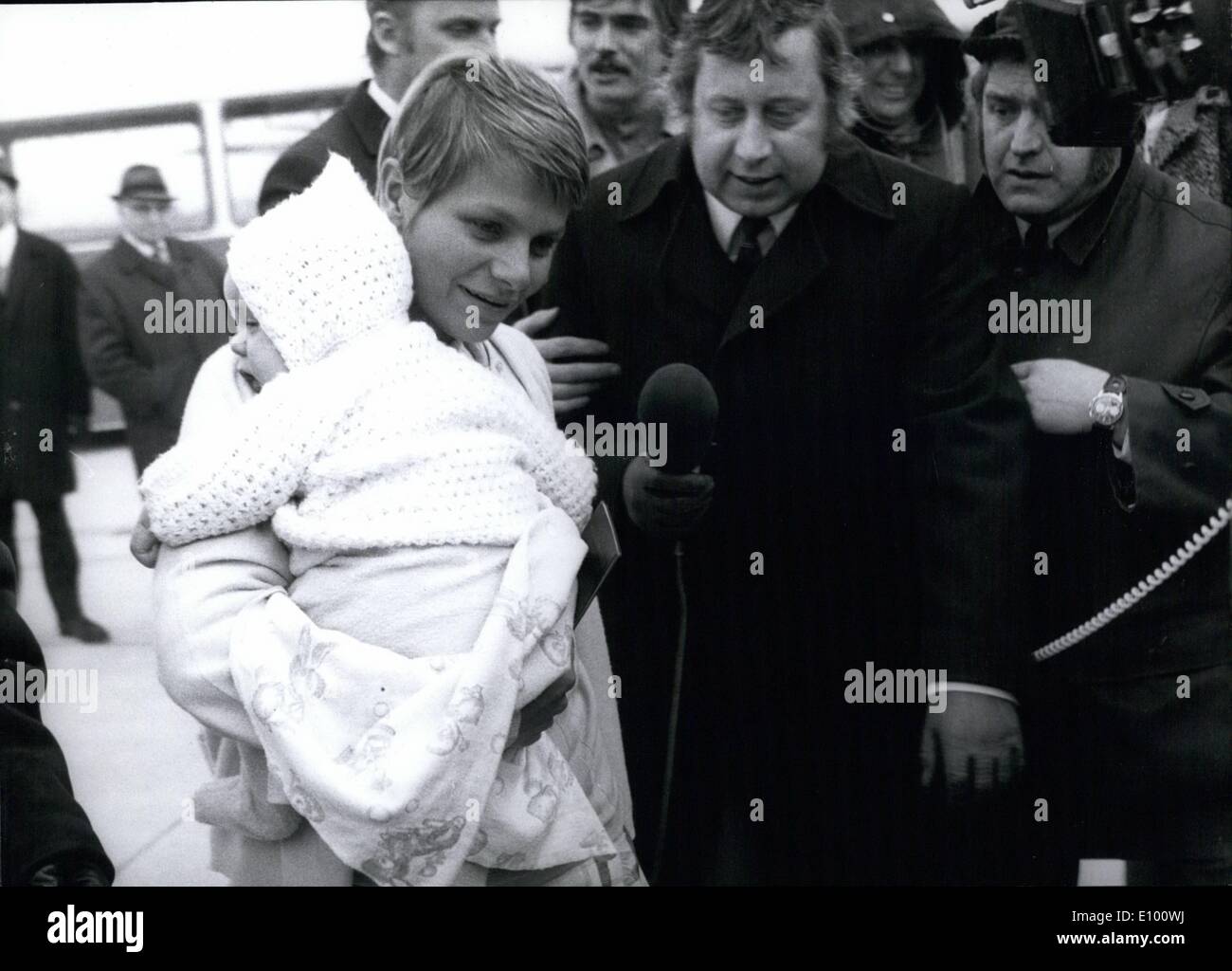 Feb. 02, 1972 - 50 Freed Jumbo Passengers Landed in Munich Very tired and still a bit frightened 37 women and 12 children and one man who were passengers on a Jumbo Jet which was hijacked 30 hours earlier on a flight to Aden, climbed out of a Boeing 727 at Munich Airport. The special plane with the freed men arrived in Frankfurt the same evening. Ops: Even the youngest passenger who is surrounded by reporters is back in safety. Stock Photo