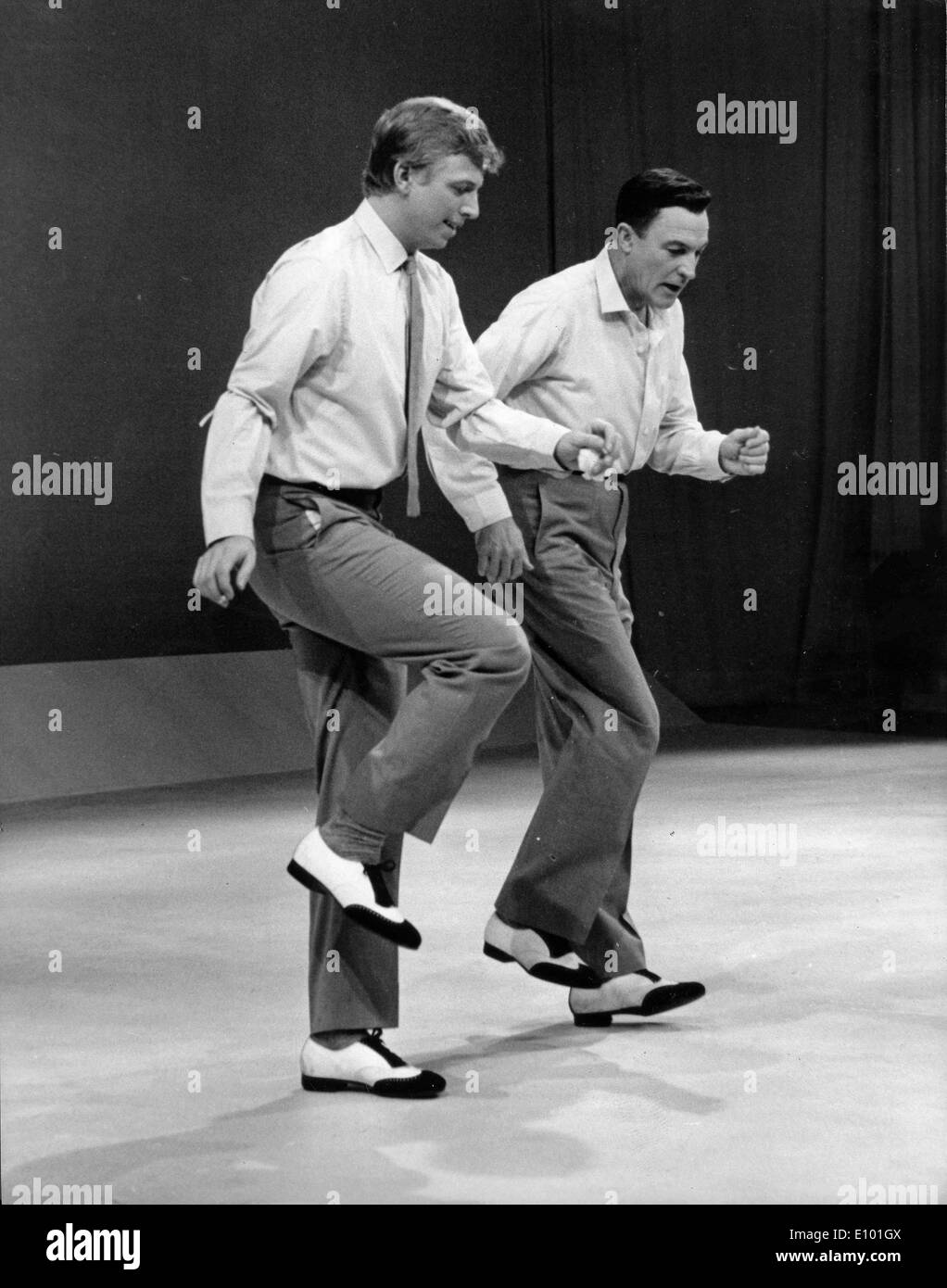 Gene Kelly and Tommy Steel rehearse for TV Stock Photo