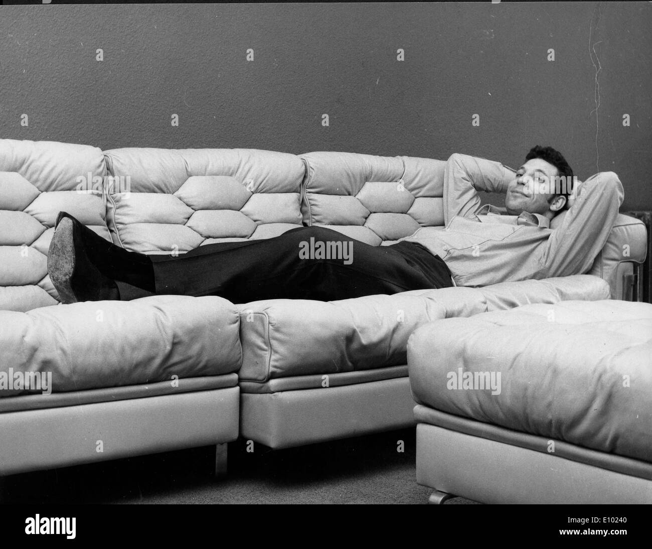 Singer Tom Jones lounges on the couch Stock Photo