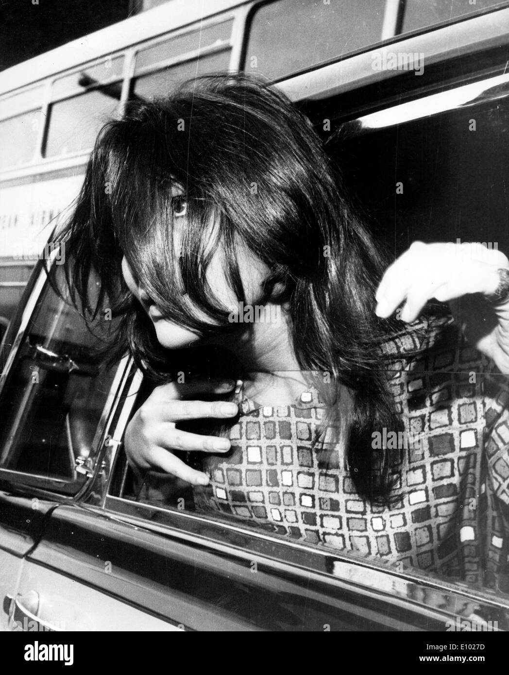 Actress Juliette Greco rides with her head out the window Stock Photo