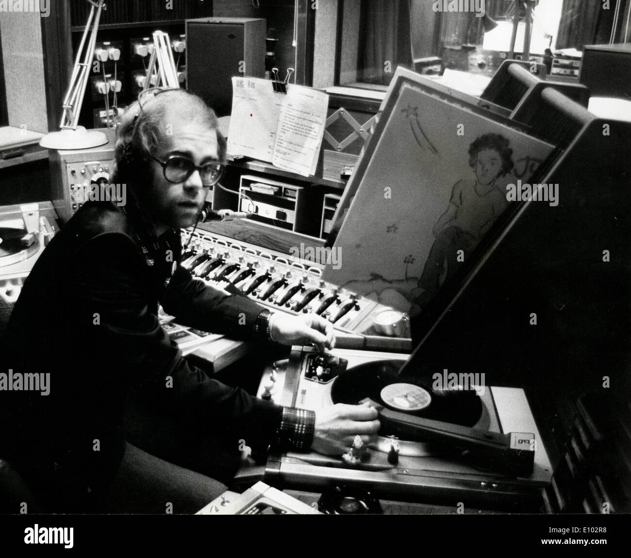 Singer Elton John works as disc jockey for radio Stock Photo