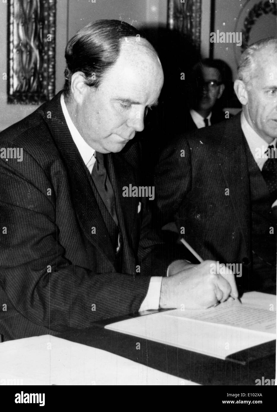 Politician Iain Macleod signs documents Stock Photo