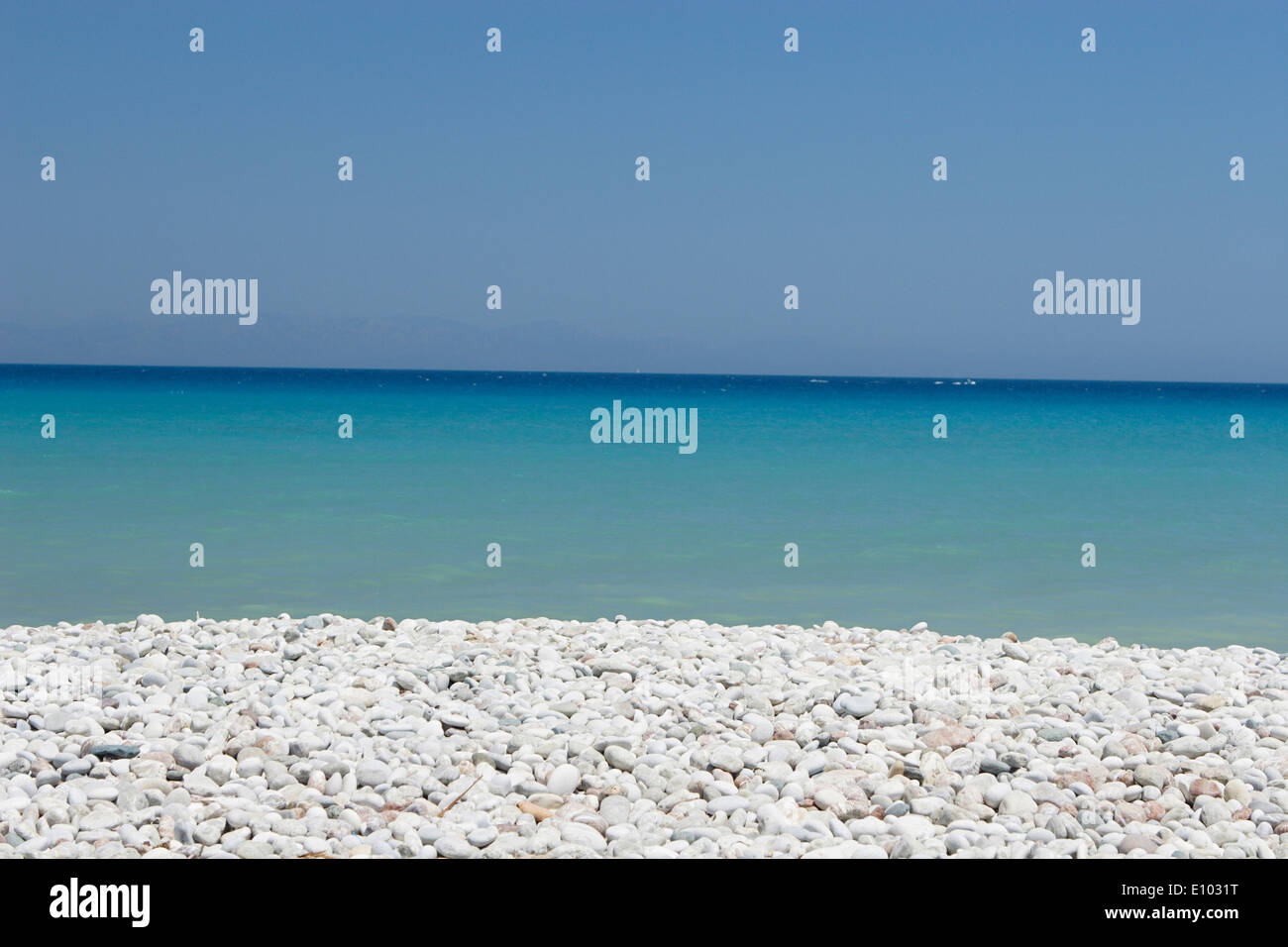 Views of the white sand and blue sky Ialyssos Bay, Rhodes, Rhodes Island, Greece Stock Photo