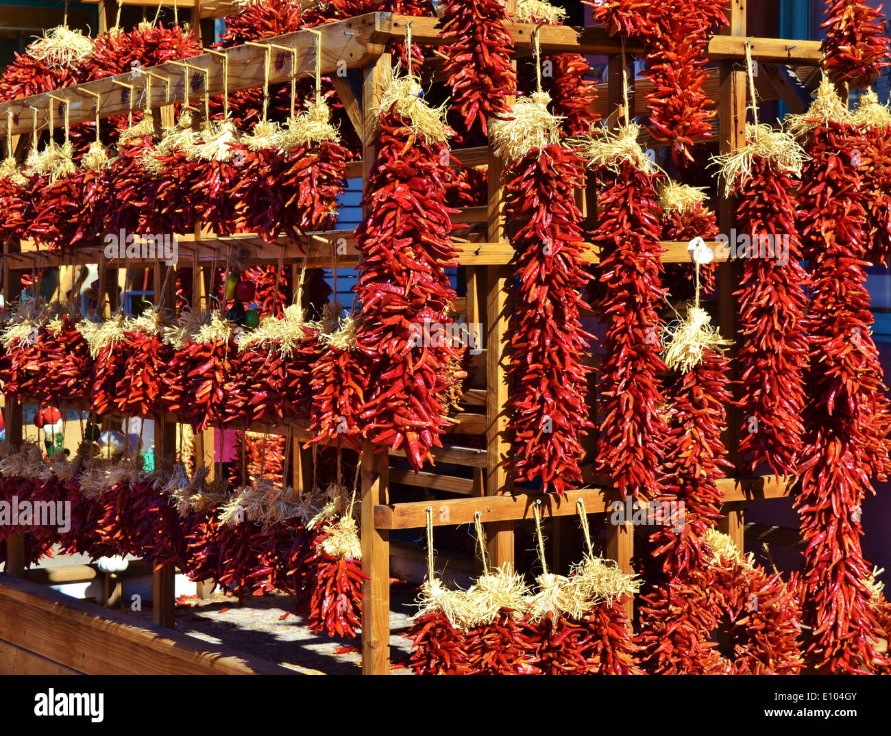 Bright Red Hanging Chili Peppers Stock Photo