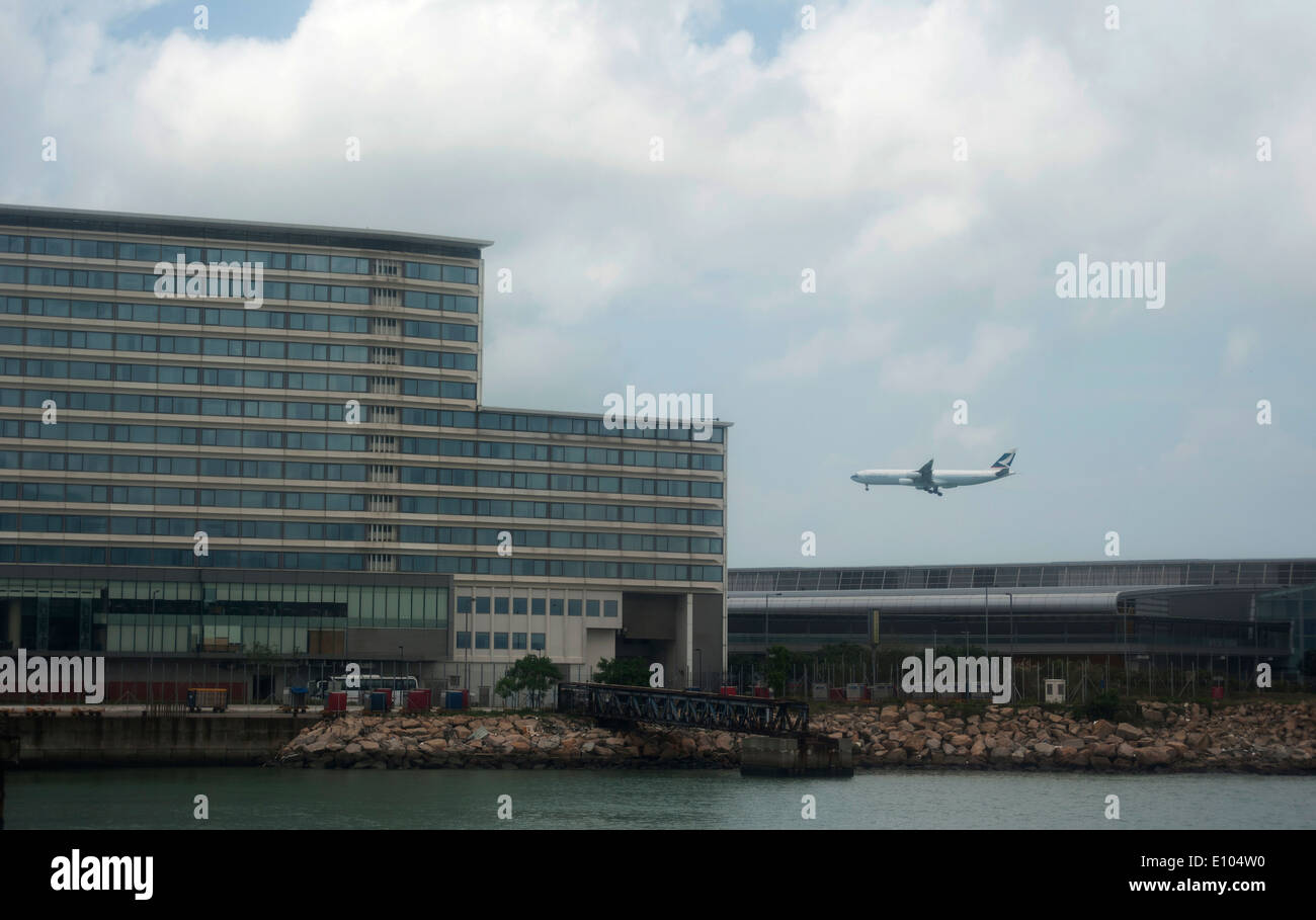 Regal Hotel overlooks plane landing at Hong Kong International Airport, Chek Lap Kok island, Hong Kong, China, South East Asia Stock Photo