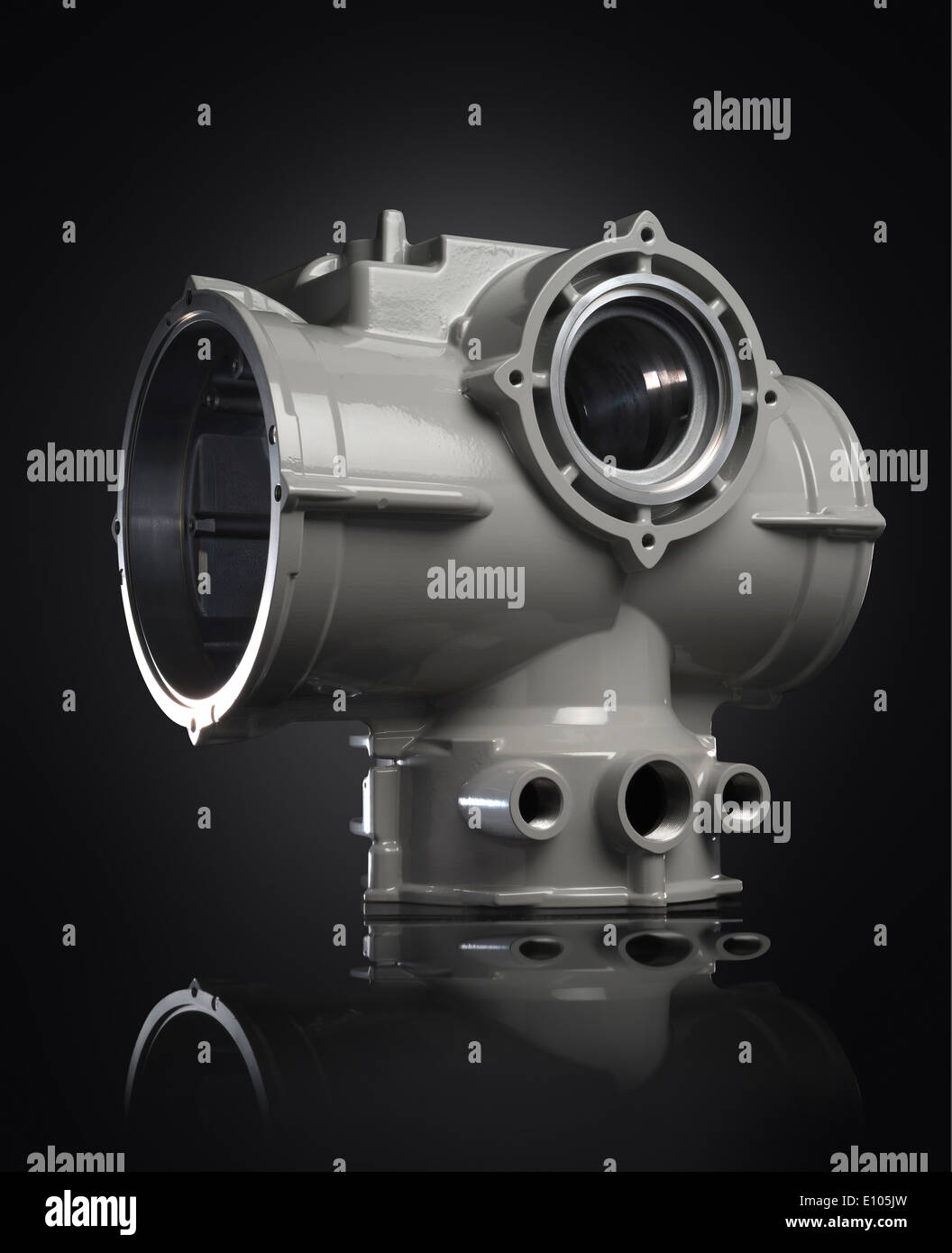 Air compressor housing part on a black reflective acrylic background Stock Photo