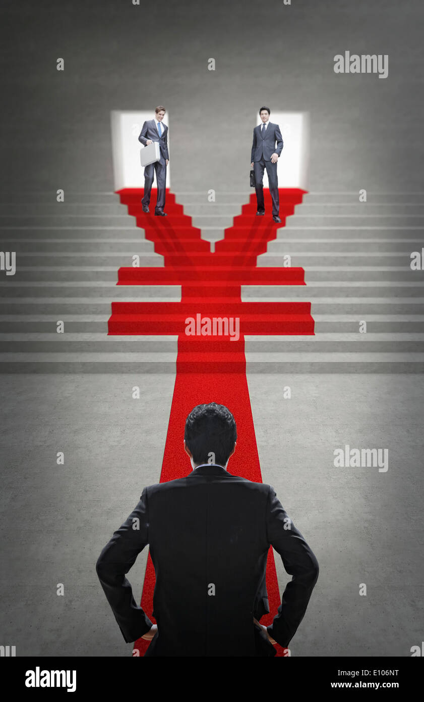 two business men walking down a Yuan shape staircase Stock Photo