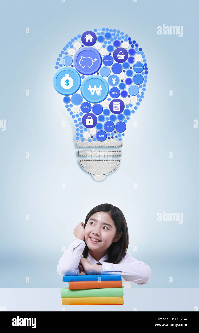 a girl leaning on a pile of books under a light bulb Stock Photo - Alamy