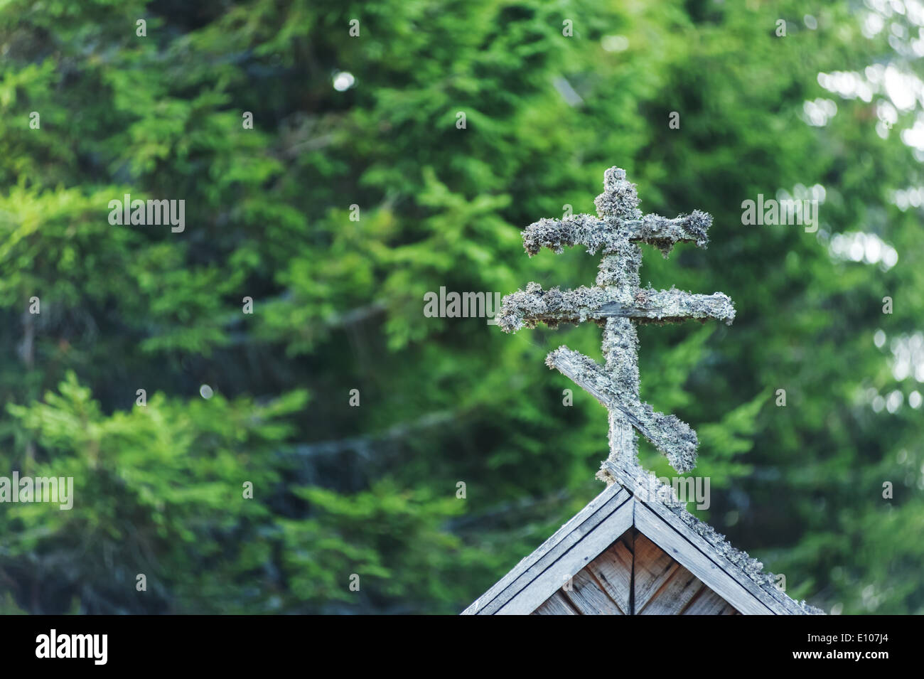 old cross on church in carpathian mountain Stock Photo