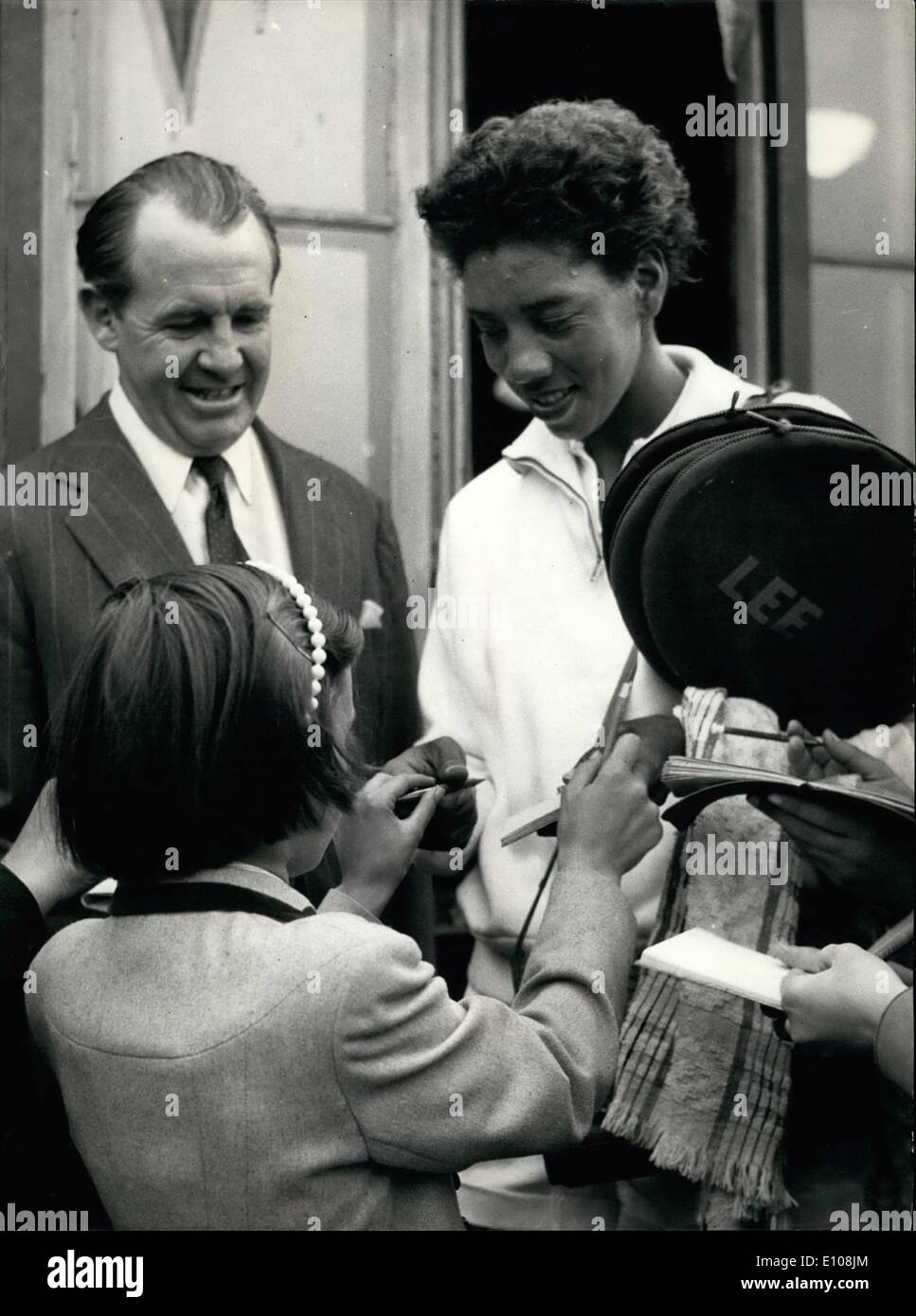 Mar. 03, 1970 - Young tennis fans at Surbiton surge round Althea Gibson to get her autograph after she had reached the semi-finals at Surbiton. Stock Photo