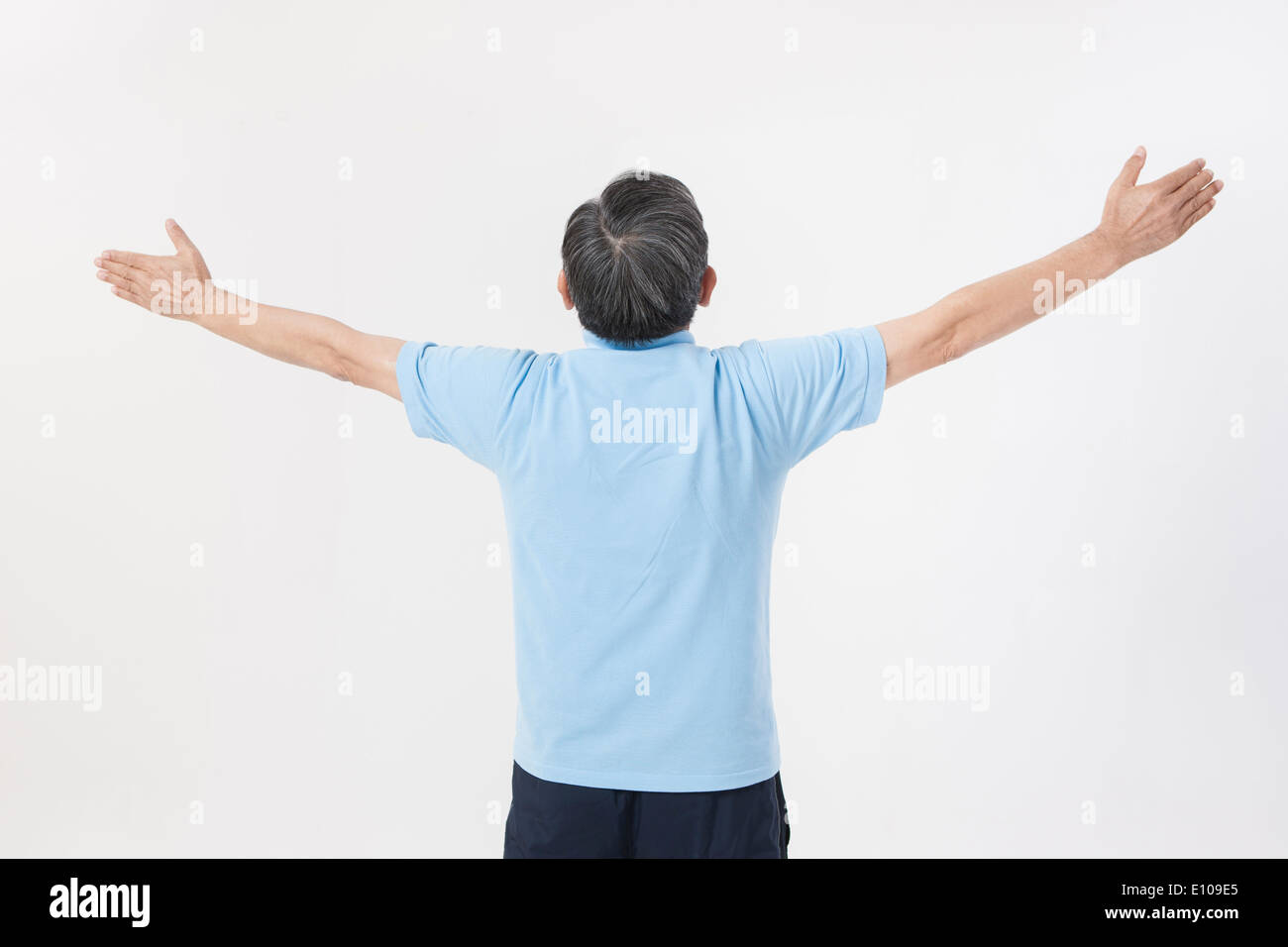an old man stretching his arms out Stock Photo - Alamy