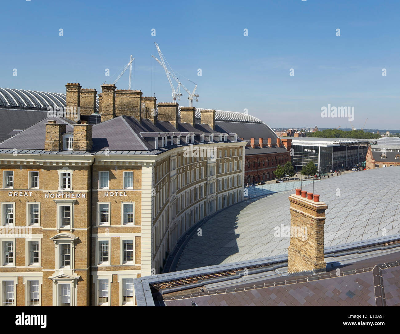 King's Cross trainshed, London, United Kingdom. Architect: Network Rail, 2013. View of rooftops towards St Pancras. Stock Photo