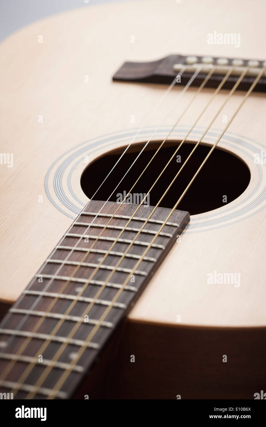 a close up of an acoustic guitar Stock Photo