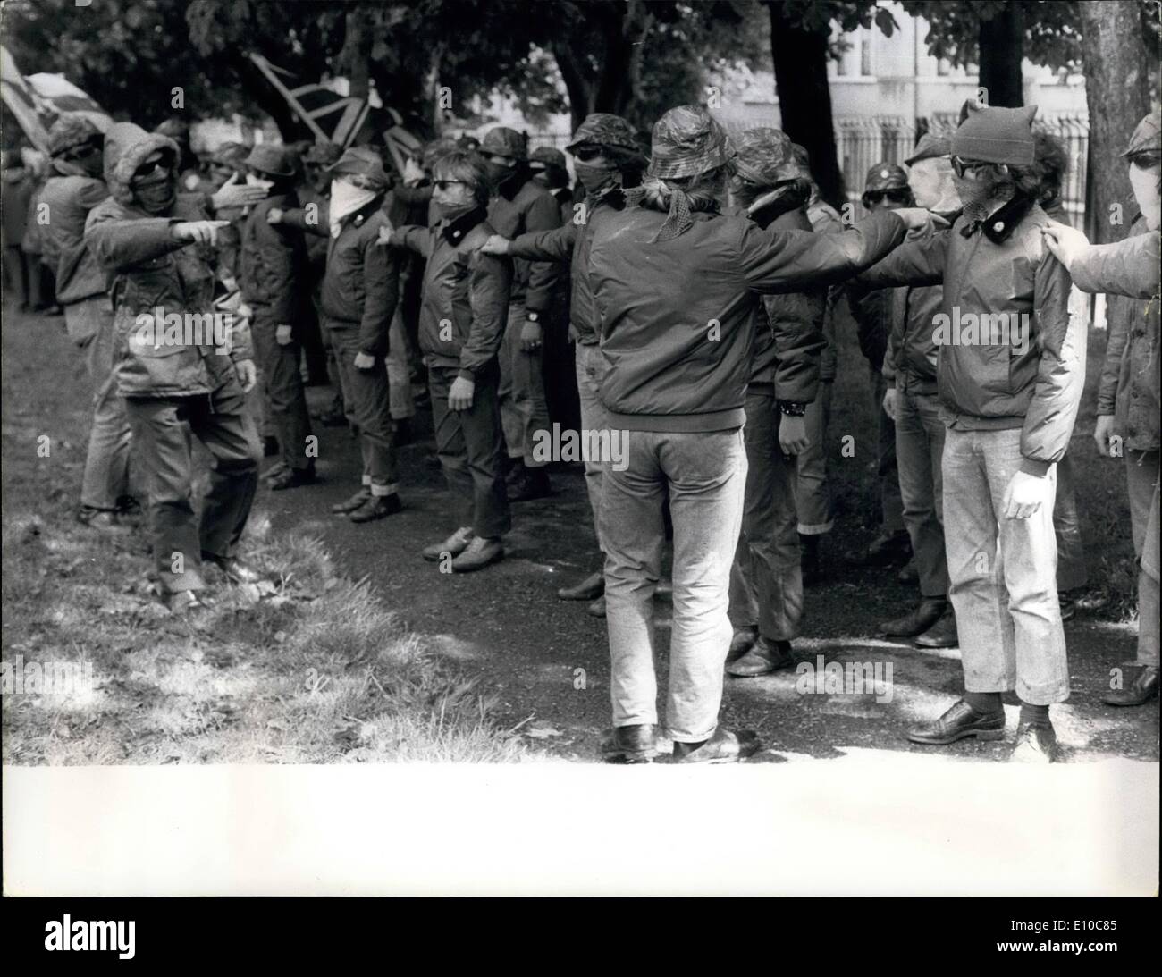 Jun. 06, 1972 - U.D.A in secret training: Members of the Ulster Defense Association have recently have recently begun guerilla-warfare training in a secluded camp on the outskirts of Ulster. The masked members are on an assult and the finer points of handling weapons. The U.D.A. is a protestant group who have fashioned themselves in full military procedure. Even when marching through the main streets of Belfest they stick to their formal drill, as showing during the recent rally at Woodvele Park, Belfast Stock Photo