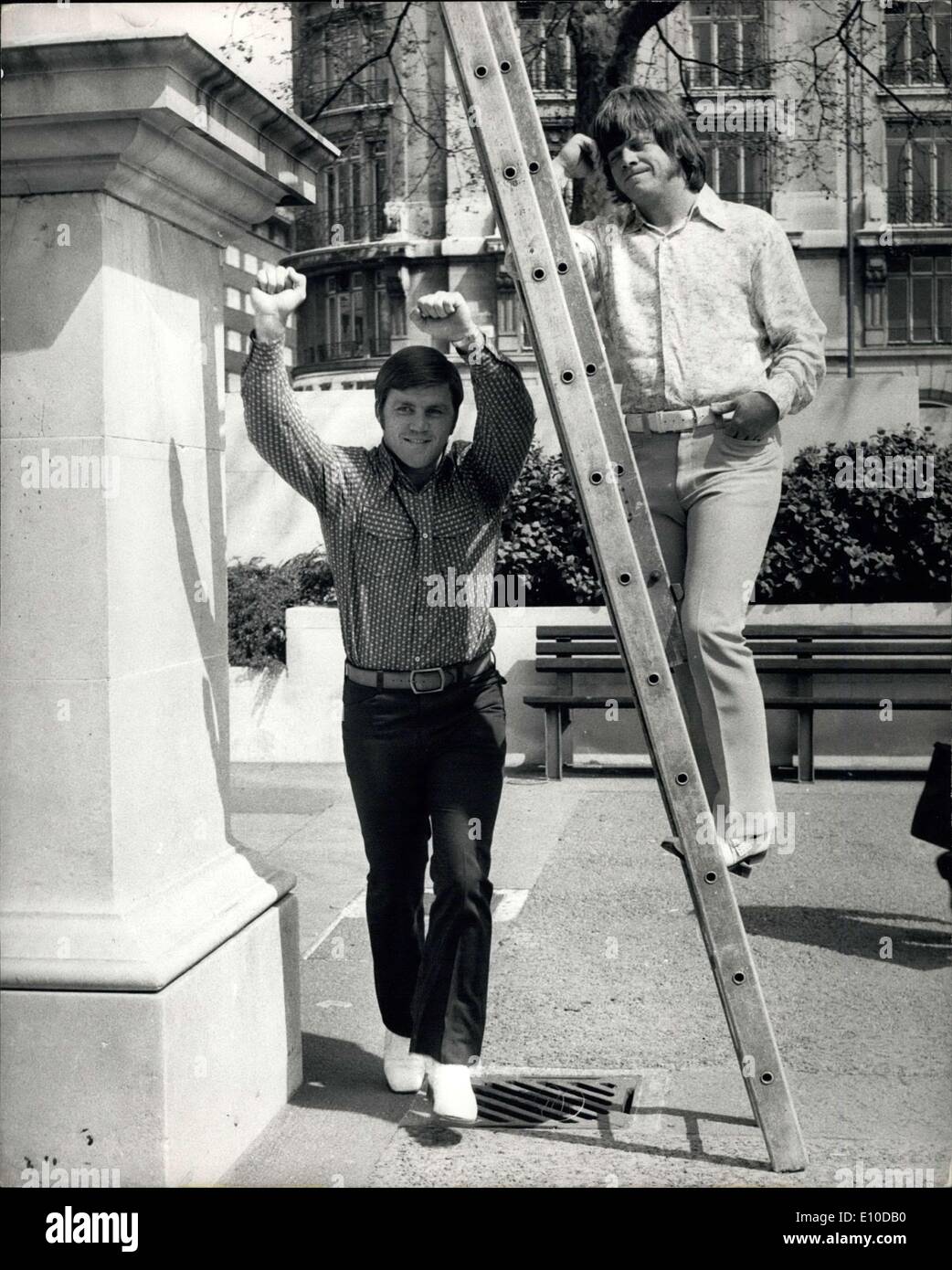 Apr. 25, 1972 - Heavy Weight Jerry Quarry in London:Jerry Quarry, the world rated heavyweight, is in London for his fight against fellow American Larry Middleton at Wembley on May 9th. Photo Shows Jerry Quarry proves he's not superstitious by running under a ladder watched by his brother JIM, who is also his assistant trainer in London today. Stock Photo